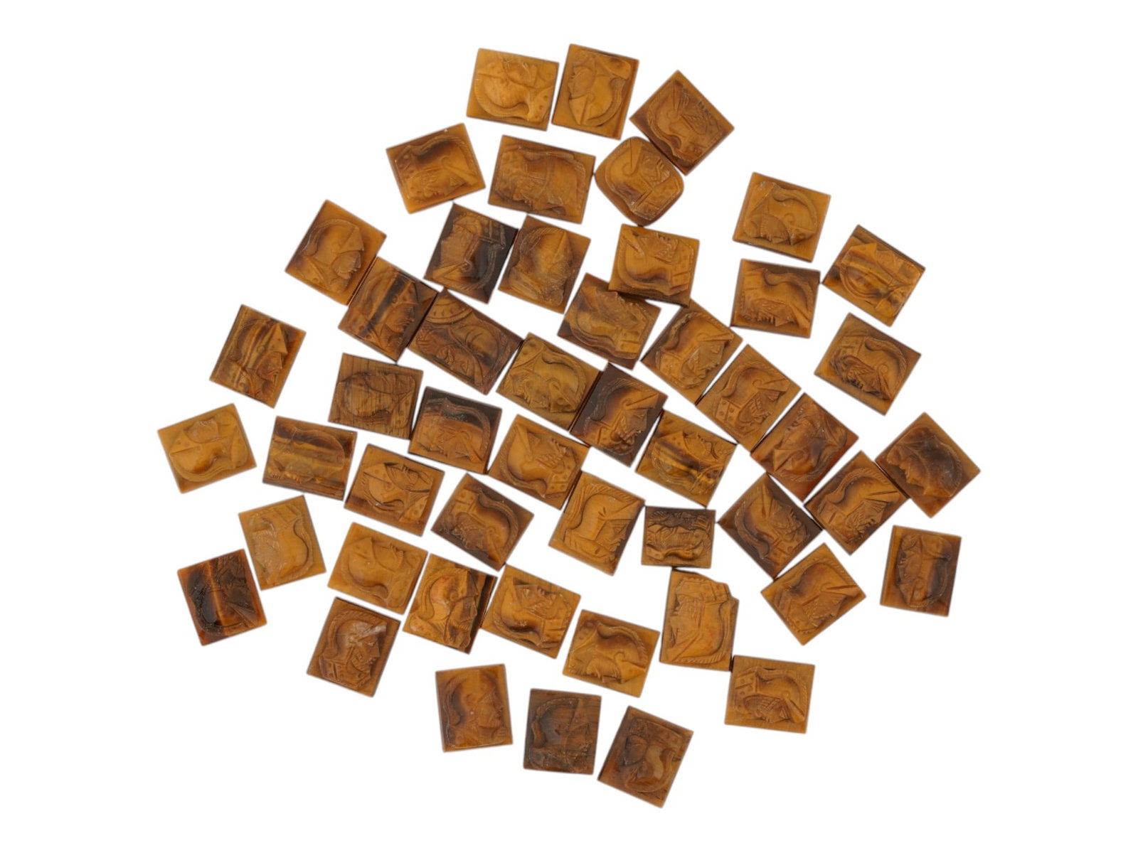 COLLECTION OF PORTRAIT CARVED TIGERS EYE CAMEOS: A collection of hand carved tigers eye stone cameos. Each piece features a knight profile portrait rendered in high relief. Rectangular shape. Collectible Jewelry And Glyptic Art, Sculpture, Mineral S