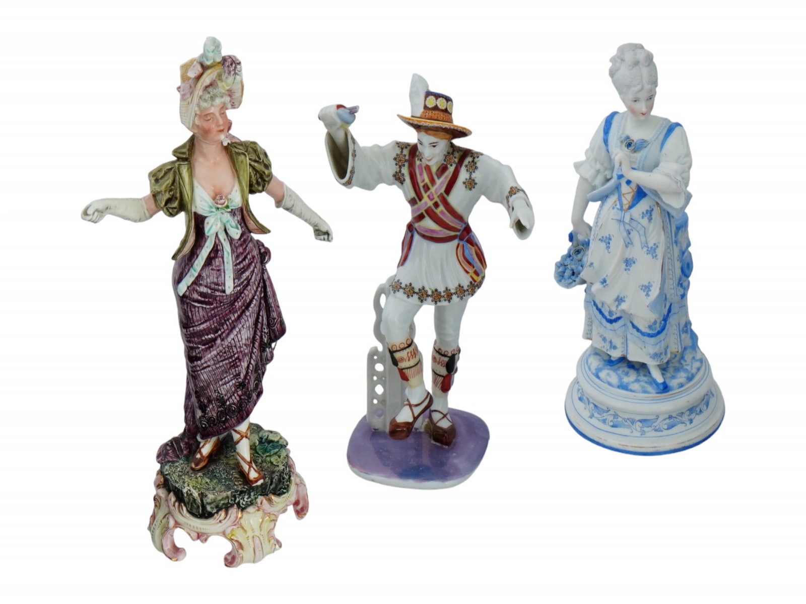 LARGE VINTAGE GLAZED PORCELAIN FEMALE FIGURINES: A lot of three large vintage glazed porcelain figurines. A hand-painted figurine of a woman in Victorian era attire. Gilt accents, footed stand. Unmarked. Second. A blue and white figure of a young pe
