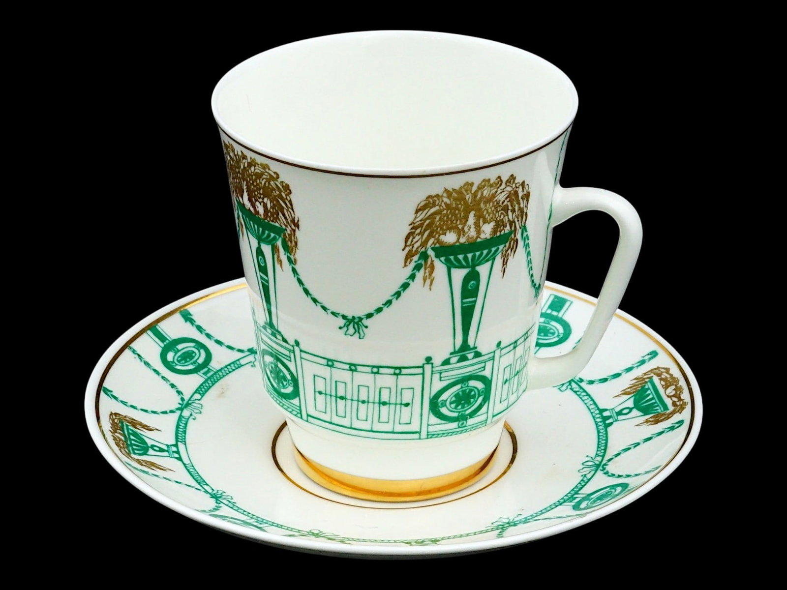 RUSSIAN SOVIET LFZ PORCELAIN SUMMER GARDEN TEA PAIR: A Russian Soviet era porcelain tea pair. Dated ca. 1970s to 1980s, LFZ, Leningrad Porcelain Factory. Summer Garden design in green and gold. Marked on the bottom. Keywords: Collectibles, Porcelain War