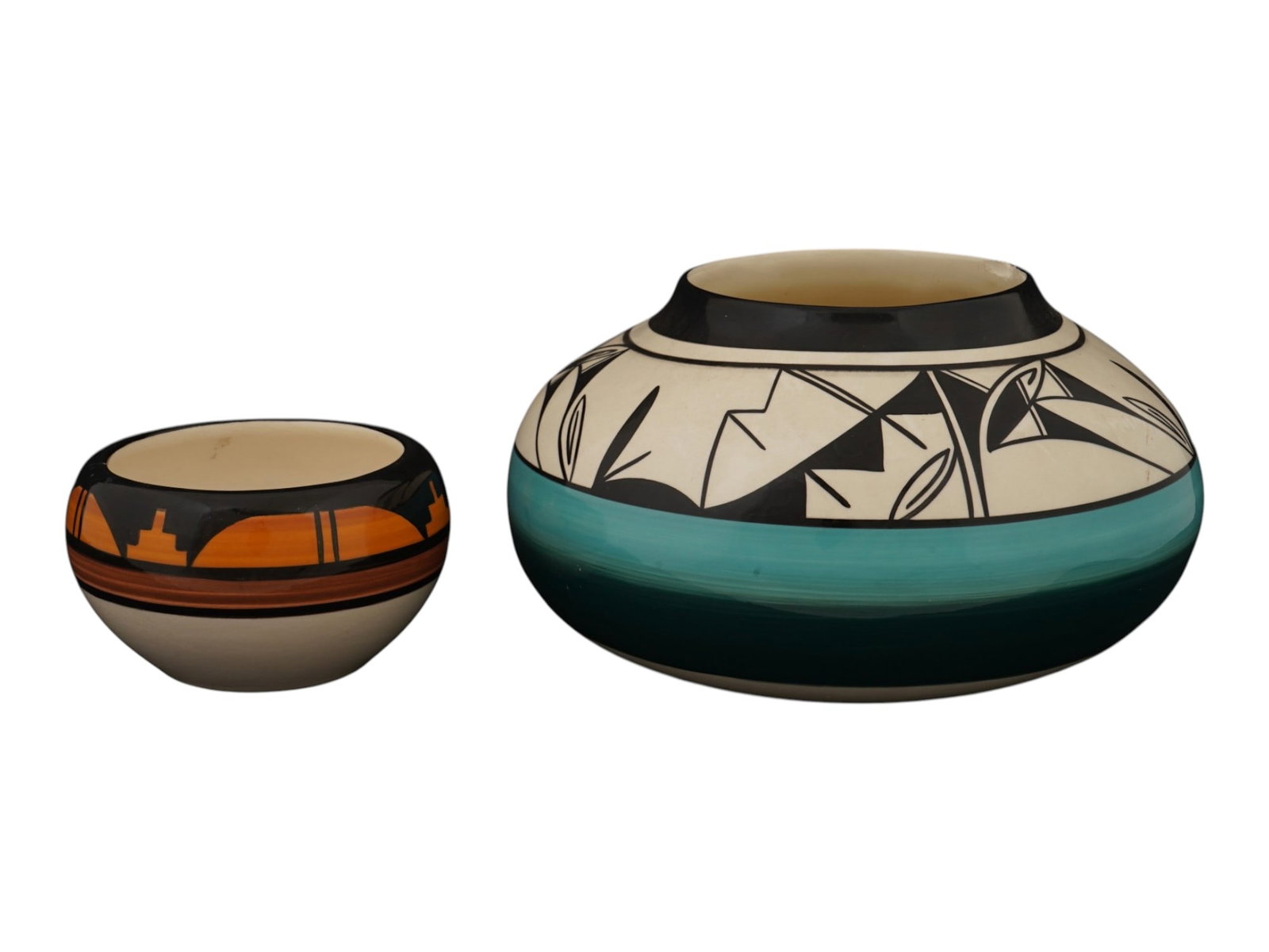 PAIR OF AMERICAN PUEBLO POLYCHROME POTTERY VESSELS: A pair of American Pueblo polychrome pottery vessels, hand-coiled and decorated in the traditional Southwest ceramic style. The group includes a small bowl with classic geometric motifs and a larger o
