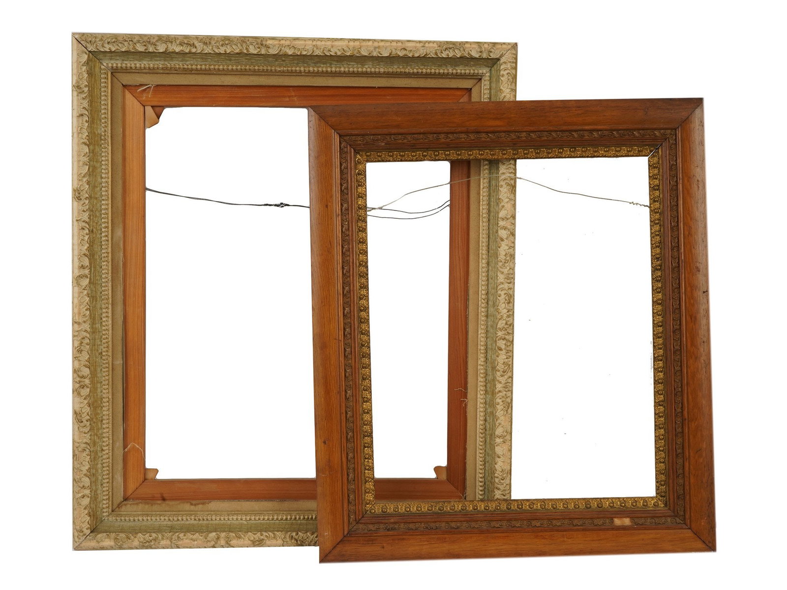 TWO VINTAGE CARVED WOOD GILT PICTURE FRAMES: A lot of two vintage carved wood gilt picture frames. Rectangular frames of varying color and dimensions. Home Decor and Collectibles. THIS LOT IS ELIGIBLE FOR A 30-DAY UNCONDITIONAL RETURN FROM THE D