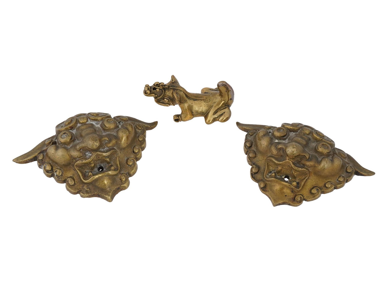 ANTIQUE AND VINTAGE BRONZE OBJECTS MASKS AND FIGURINE: A group of three antique and vintage bronze objects, including two finely cast mask plaques and a mythological animal figurine. Antique And Vintage Bronze Collectibles. THIS LOT IS ELIGIBLE FOR A 30-D