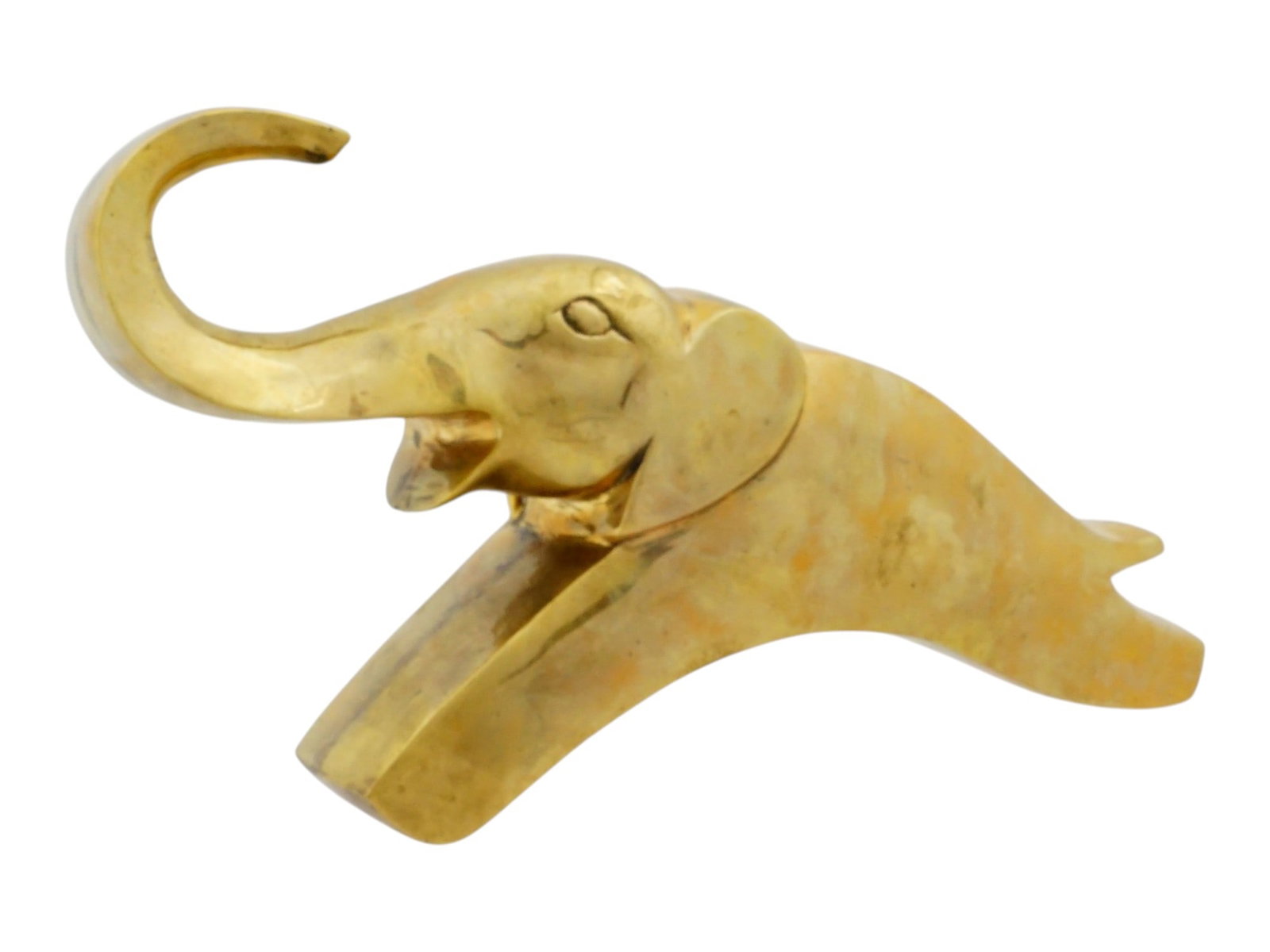 AMERICAN BRASS ELEPHANT FIGURINE ATTR DOLBI CASHIER: A vintage American postmodern gilt brass elephant figurine attributed to Dolbi Cashier. Circa the late 20th century, the 1980s. The elephant is designed in a minimalist aesthetic, in a stylized, dynam