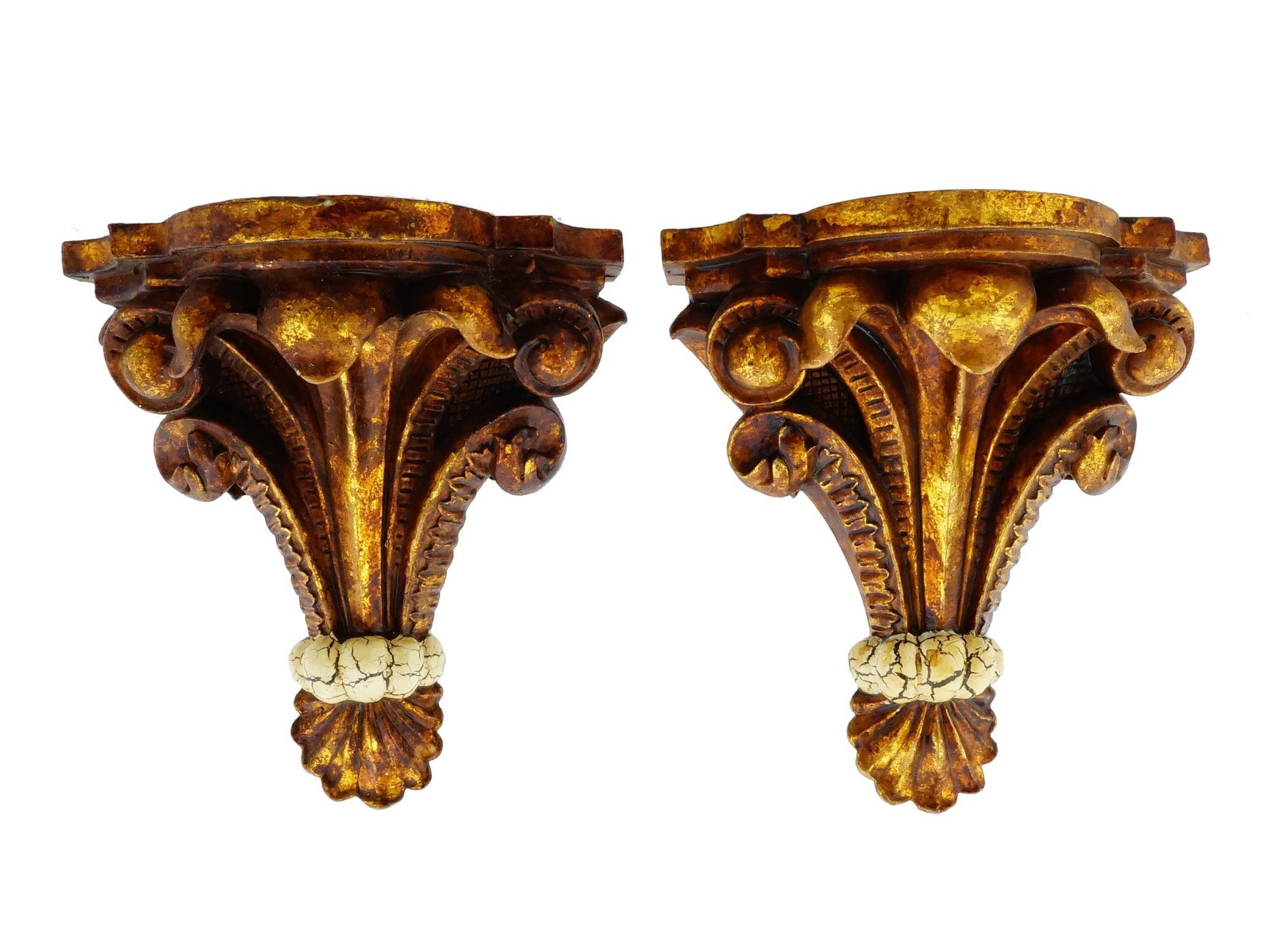 PAIR OF ANTIQUE EUROPEAN GILT WOOD WALL BRACKETS: A pair of antique European gilt wood wall brackets with relief rocaille designs. Circa the first half of the 20th century. Flat tops. Each item has a hanger for attaching to the wall. Collectible Wall