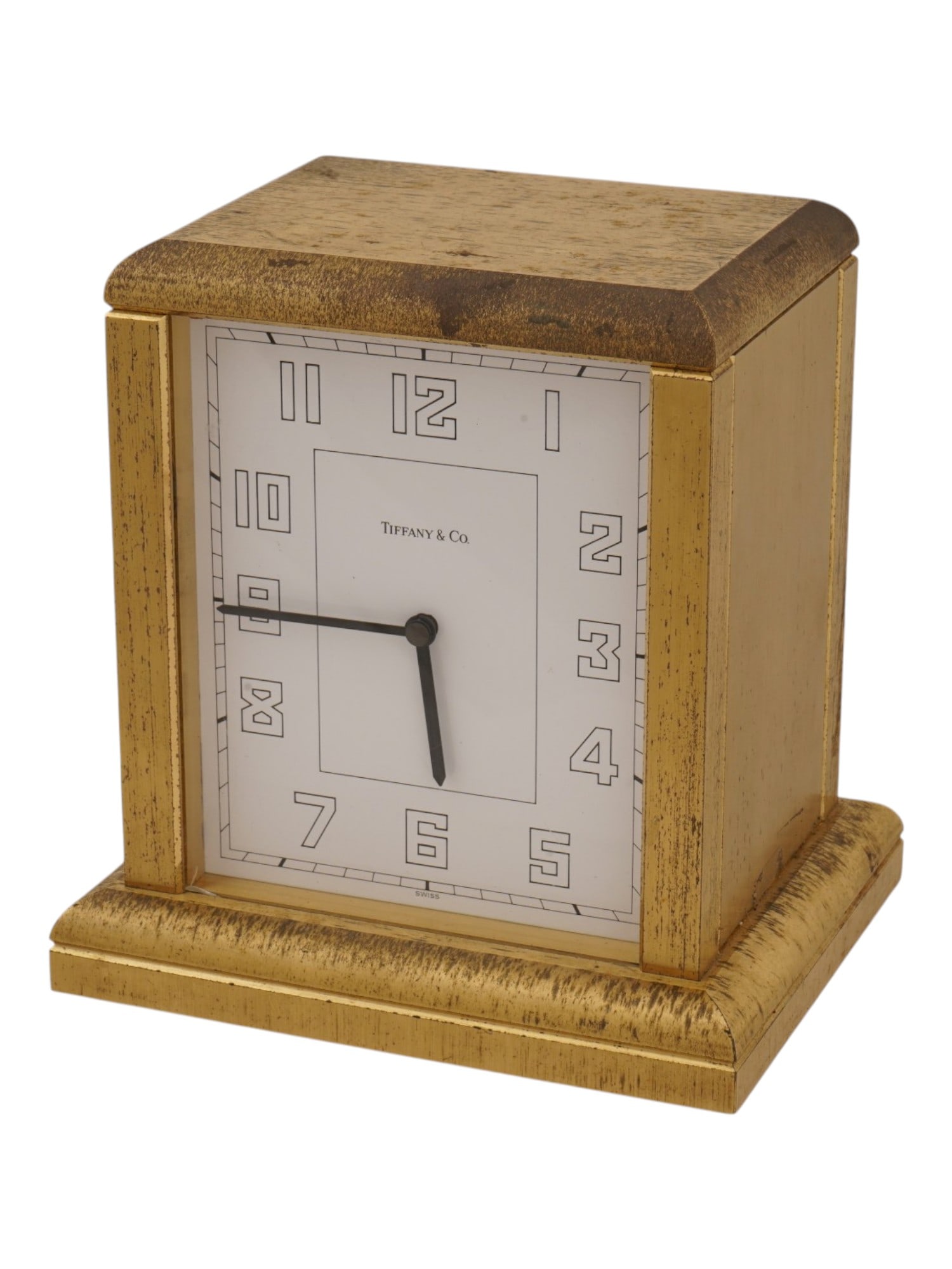VINTAGE TIFFANY AND CO BRASS TABLE CLOCK: A vintage table clock by Tiffany and Co. Square gilt brass case. White dial with geometrized Roman numerals, marked Tiffany and Co., Swiss. Collectible Clocks And Watches, Home Decor. THIS LOT IS ELIG