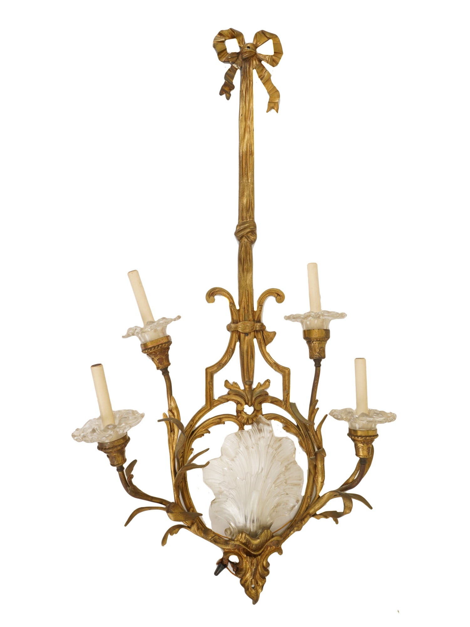 LOUIS XVI STYLE ELECTRIC GILT BRONZE WALL SCONCE: A Louis XVI style electric gilt bronze wall sconce. It features classic Louis XVI and Regency motifs, including a prominent bow-tied crown at the top and frosted glass shades. Adorned with four upward