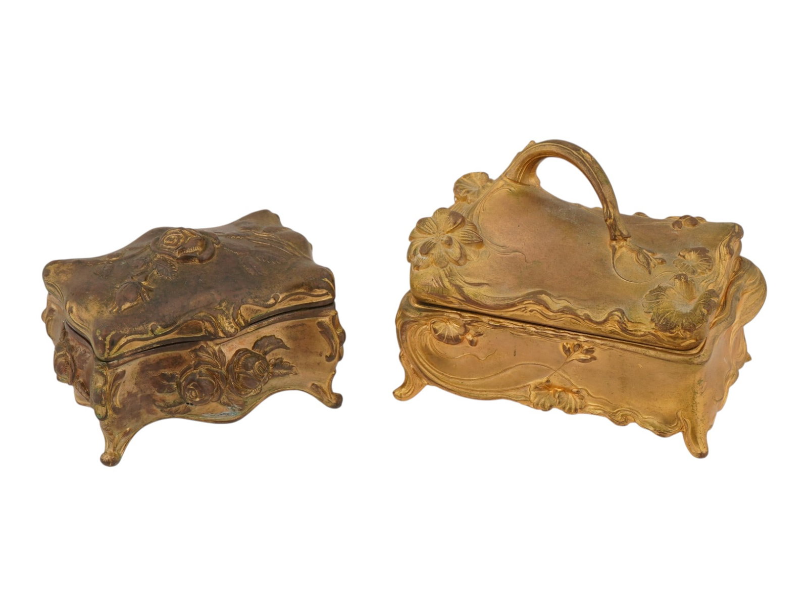 PAIR OF ANTIQUE ART NOUVEAU BRASS TRINKET BOXES: A pair of antique Art Nouveau brass trinket boxes dating to the early of the 20th century. One features high-relief roses and scrolling vines, the other displays flowing floral ornament with a gracefu