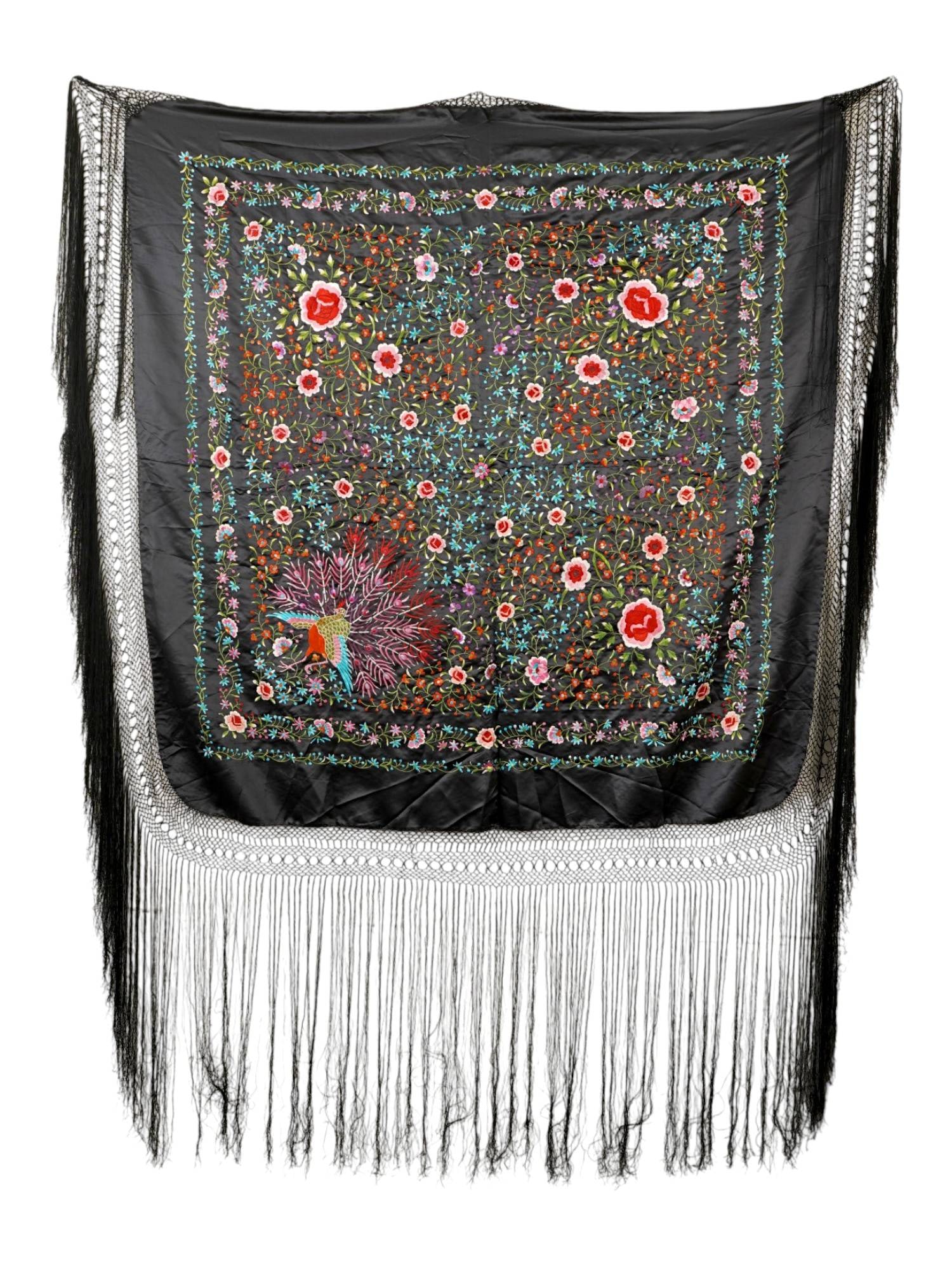 VINTAGE HAND EMBROIDERED BLACK SILK MANILA SHAWL: A vintage Manila shawl, a traditional scarf popular in the Philippines, Latin America, and Spain. Square black piece embroidered in chinoiserie-style floral motifs, as well as a peacock. Long fringes.