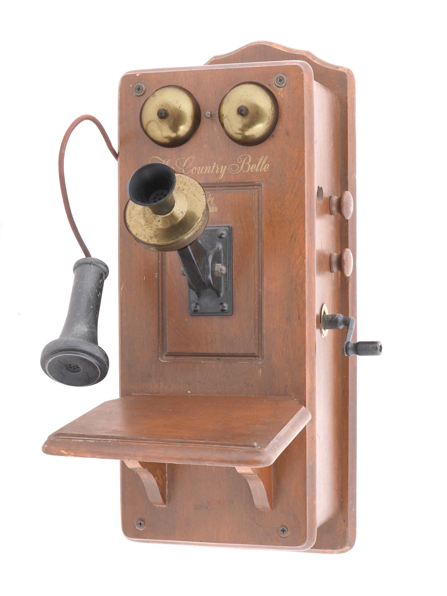 COUNTRY BELLE GUILD RADIO RECEIVER TELEPHONE RADIO: A vintage The Country Belle Telephone Superheterodyne Novelty Radio Receiver model 556. By Guild Radio And Television Co, Inglewood, California. The Guild Country Belle is one of the most recognizable