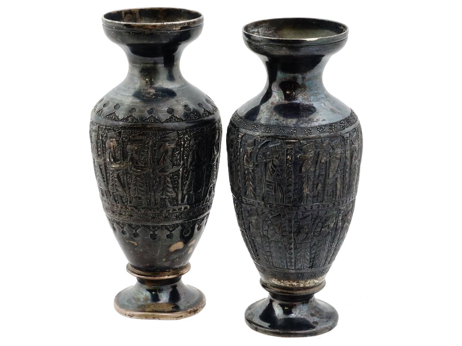 ANTIQUE PERSIAN GHALAMZANI SILVER BALUSTER VASES: A pair of antique Persian silver baluster vases decorated in the traditional Ghalamzani style. The richly engraved surfaces feature Achaemenid-inspired figures and soldiers, framed by geometric and fl