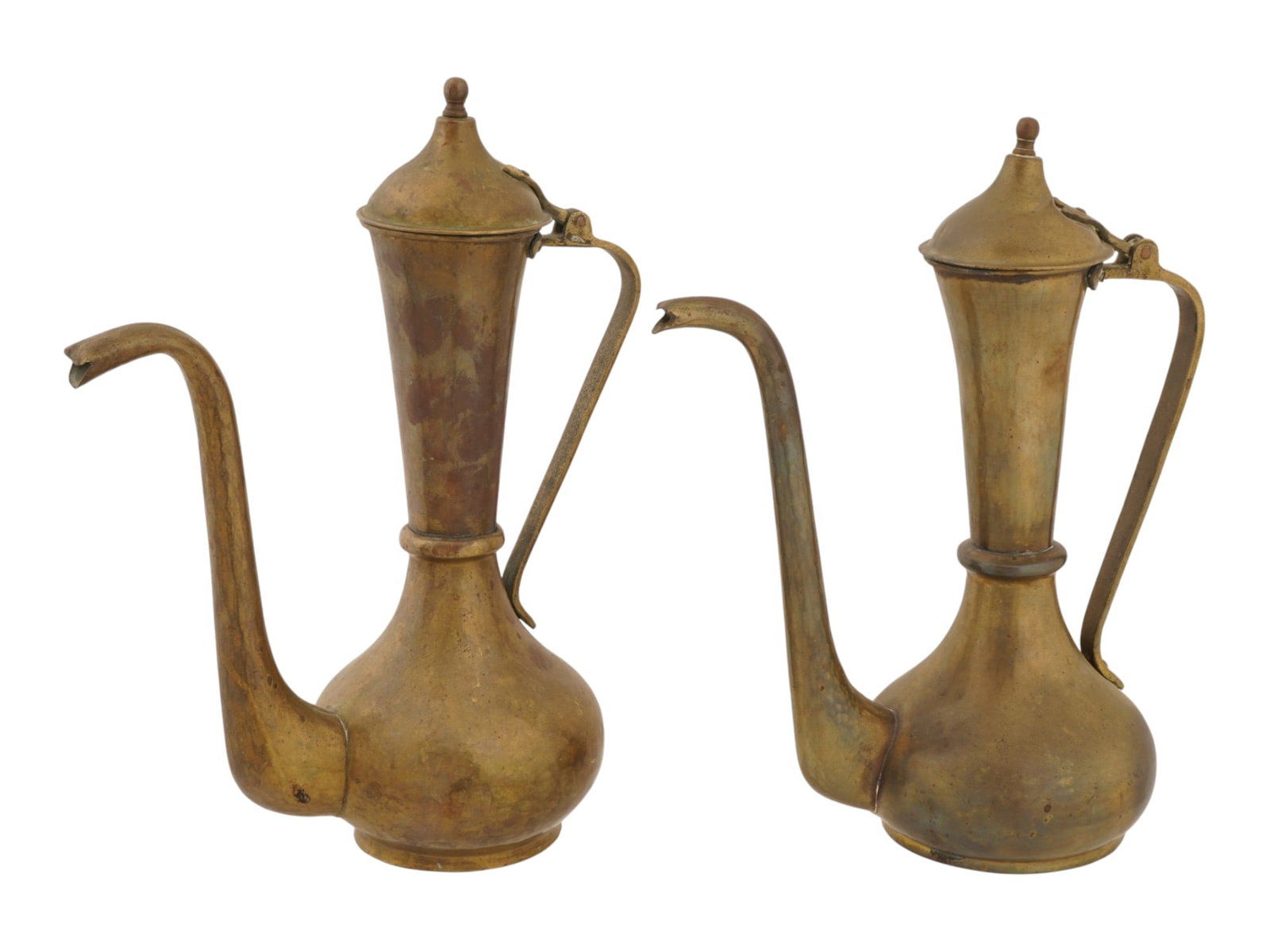 PAIR OF TURKISH BRONZE COFFEE POTS WITH HINGED LIDS: A pair of Turkish bronze coffee pots. Each ware has a bulbous body with a narrow neck, a long curved spout, a handle, and a hinged lid. The handles are decorated with engraved ornaments. Antique and V