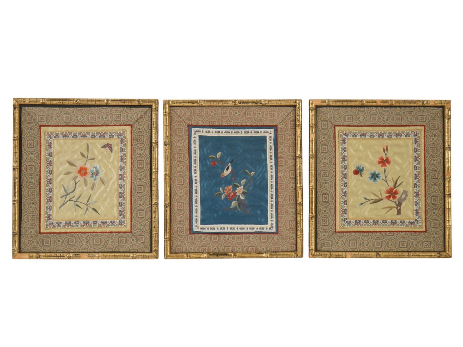 TRIPTYCH OF VINTAGE CHINESE SILK EMBROIDERY PANELS: A triptych of vintage Chinese silk embroidery panels depicting traditional floral and avian motifs. Hand-stitched in silk thread, the panels feature butterflies, blossoms, berries, and a bird on a flo