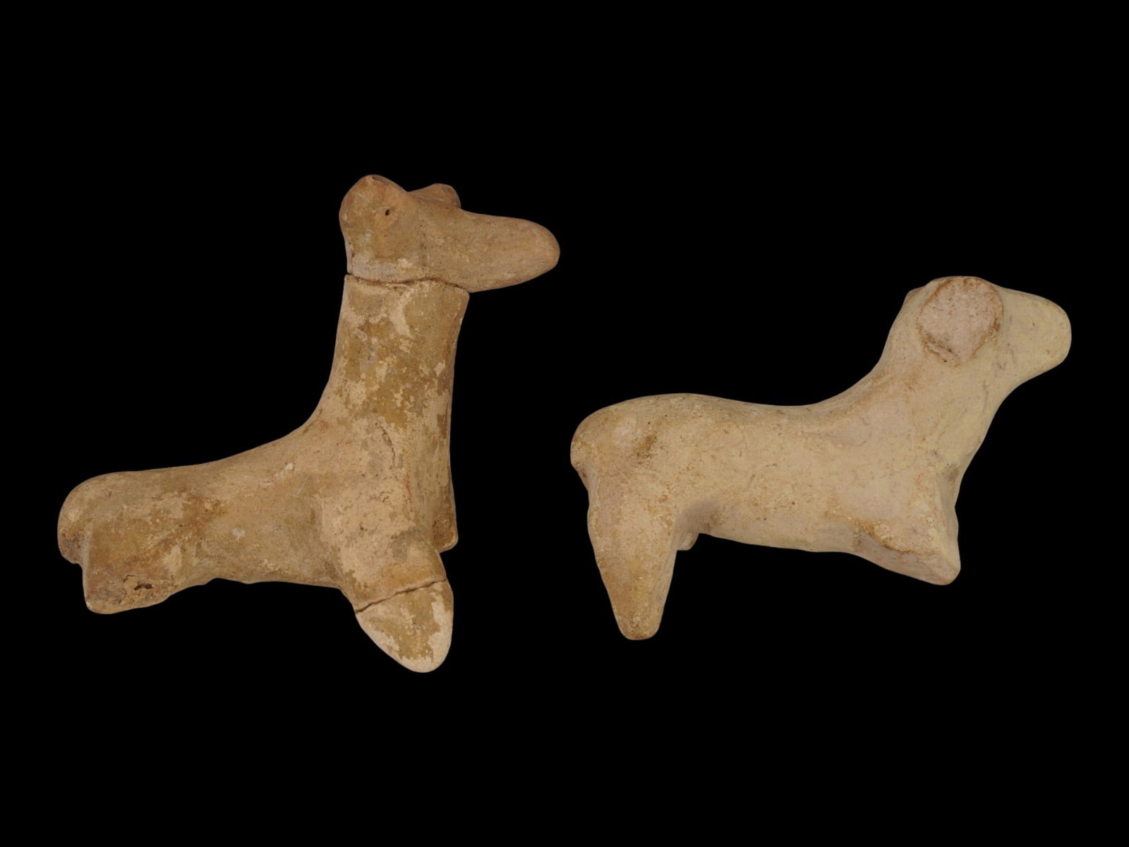 TWO ANCIENT HITTITE TERRACOTTA POTTERY FIGURINES: A lot of two ancient Hittite terracotta pottery figurines, dating from the Late Bronze Age between 1600 and 1100 BC. The figurines are modeled in the form of stylized animals, possibly horses or rams.