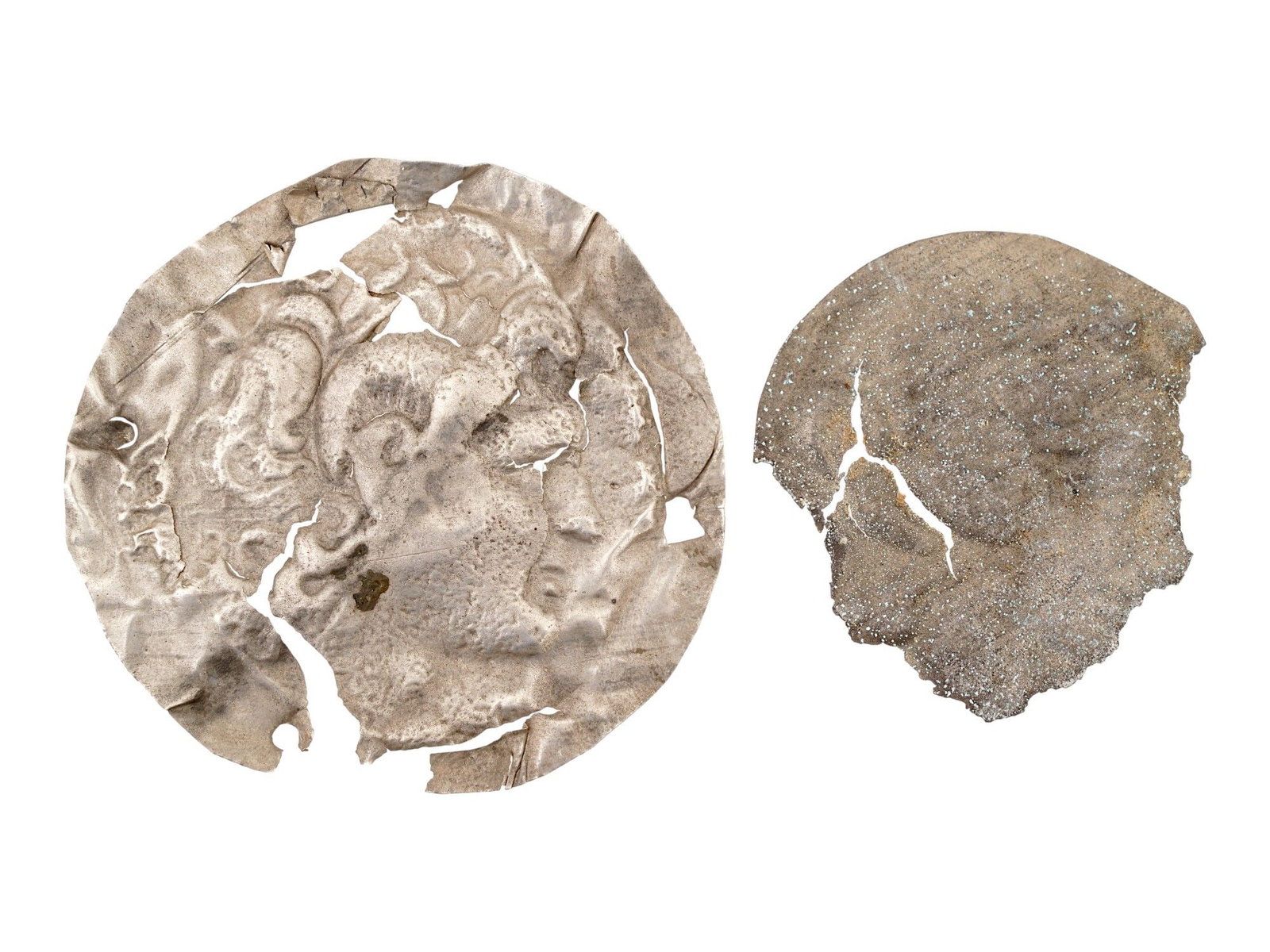 ANCIENT GREEK PORTRAIT SILVER PLAQUES 400 TO 300 BC: A lot of two ancient Greek Silver plaque. The circular shaped plaques depict embossed portraits in profile. Circa: 400 to 300 BC. Ancient Greco Roman Gold Plaques and Plates, Museum Pieces, and Collec