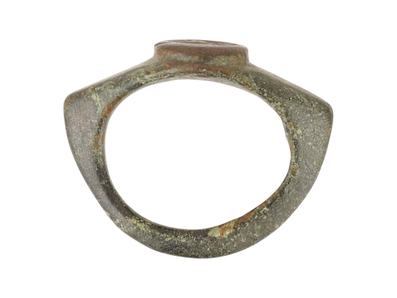 ANCIENT ROMAN BRONZE SIGNET RING 100 TO 300 AD: An ancient Roman bronze signet ring, dating circa 100 to 300 AD, features an oval bezel. The bezel is engraved with the head of the emperor. The hoop is characterized by a slightly flattened cross-sec