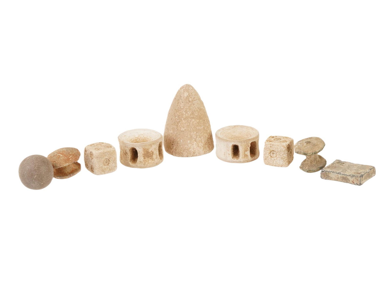 9 ANCIENT EGYPT ROMAN PERIOD STONE GAMING PIECES: A group of 9 ancient Late Period Egypt to Roman Period stone gaming pieces and dice of various shapes, dating circa 700 BC to 200 AD, comprising carved examples used for board games or counters. Forme