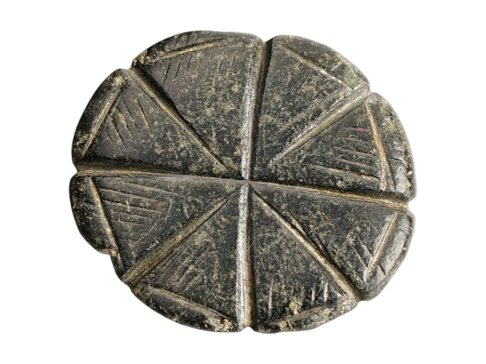 ANCIENT BYZANTINE STEATITE STAMP SEAL 400 TO 600 AD: An ancient Byzantine hand carved steatite stamp seal, circa 400 to 600 AD, features a characteristic domed handle with a transverse perforation for suspension. The circular sealing face is deeply inci