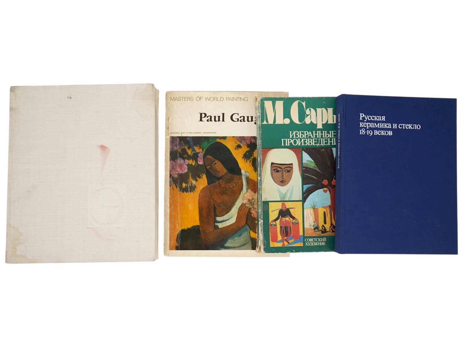 VINTAGE ART BOOKS IN RUSSIAN AND ENGLISH: A lot of four vintage art books in Russian and English. The lot includes a book The Hermitage Museum, a book Russian Ceramics and Glass of the 18th-19th Centuries - a collection from the State Histori