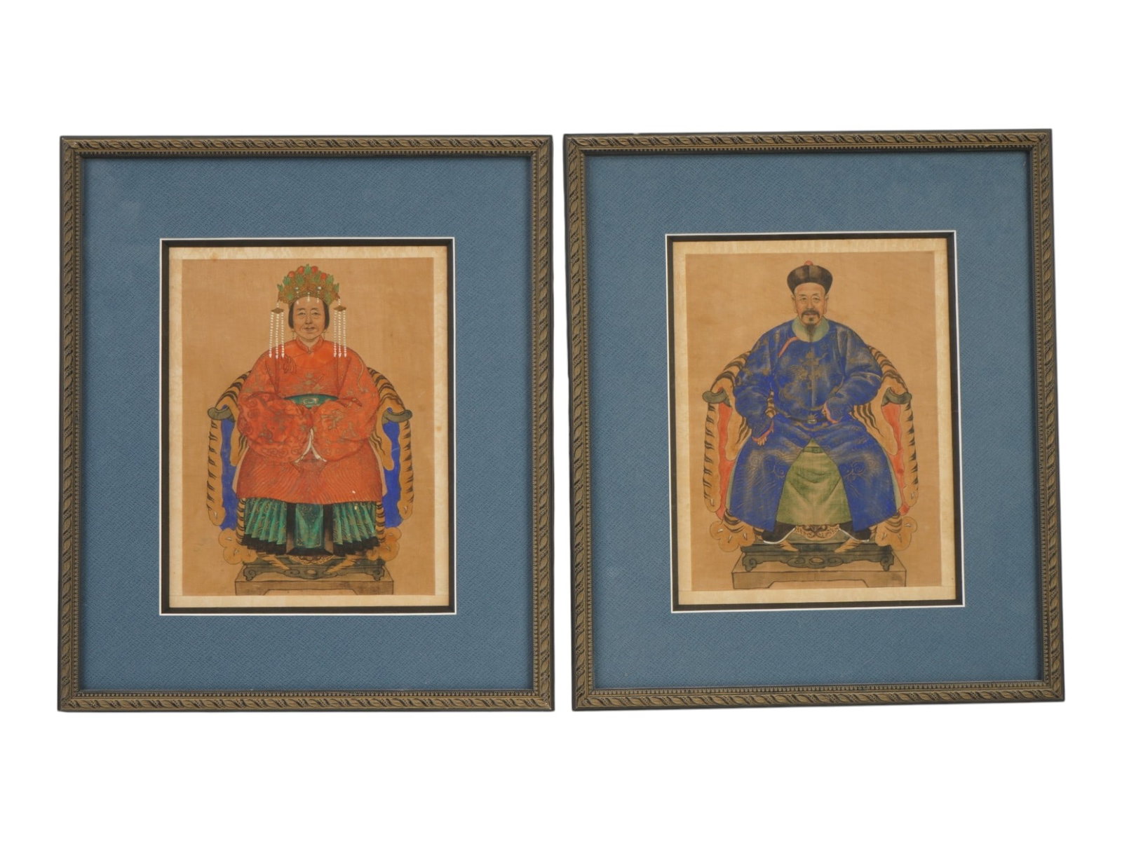 CHINESE QING ANCESTOR PORTRAIT ON SILK PAINTINGS: A set of two antique watercolor on silk Chinese Qing Dynasty ancestor portraits, circa the late 19th or early 20th century. The paintings depict a seated male official and a female companion, likely h