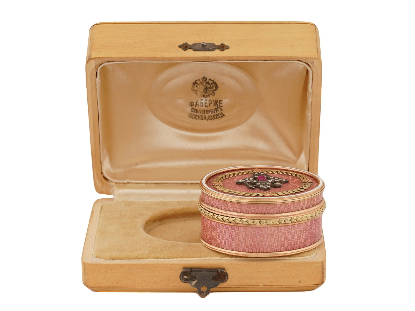 RUSSIAN 14K GOLD DIAMONDS RUBY ENAMEL PILL BOX: A fine quality Russian 56 gold and enamel pill box. The exterior of the box is covered with Guilloche enamel in a pink shade. The lid is adorned with an overlay depicting an Imperial Eagle set with di
