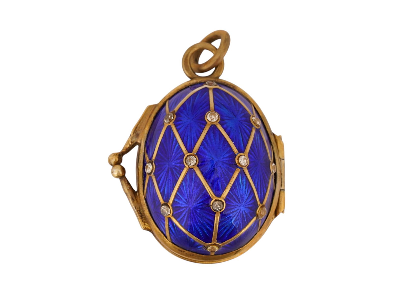 RUSSIAN SILVER ENAMEL GEMS LOCKET EASTER EGG PENDANT: A large Russian gilt silver Easter Egg-shaped locket pendant. The surface is garnished with cobalt blue enamel, lozenge design, gemstones. Hallmark of 88 silver standard and makers mark are on the