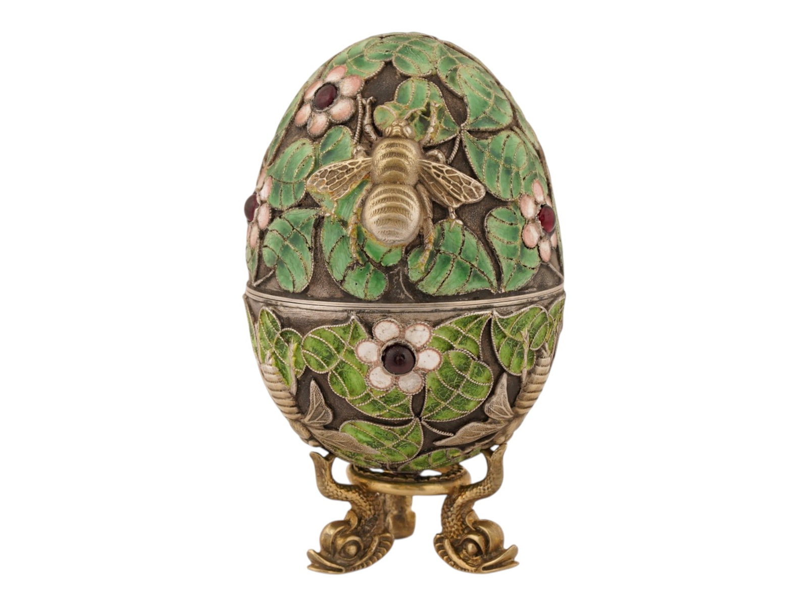 RUSSIAN GILT SILVER ENAMEL EASTER EGG BOX W GEMSTONES: A Russian gilt-silver and enamel Easter egg box. Decorated with naturalistic foliage and pink and white blossoms, accented by cabochon gemstones and applied honeybees. Resting on a distinctive tripoda