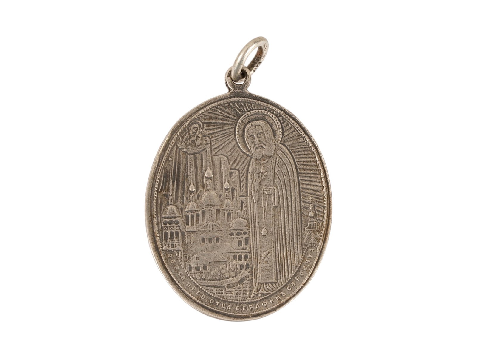 RUSSIAN SAINT SERAPHIM MOTHER OF GOD SILVER PENDANT: A Russian Orthodox religious pendant token. The front side depicts Saint Seraphim of Sarov against the backdrop of the Sarov Monastery. The obverse depicts the image of the Mother of God Umilenie