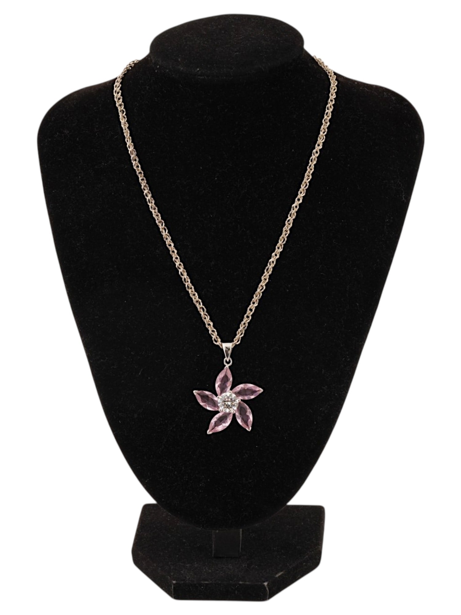 VINTAGE SILVER PINK CRYSTAL FLOWER PENDANT NECKLACE: A vintage pink crystal flower pendant necklace featuring five marquise-cut pink stones arranged in a floral motif. The design is centered with sparkling clear crystal accents and suspended from a