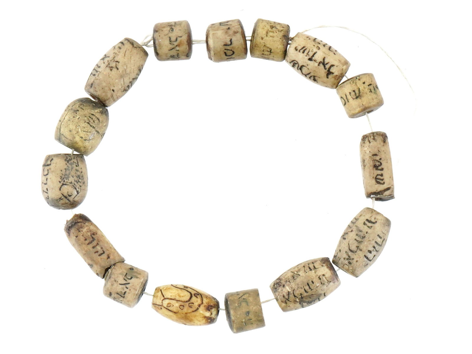 VINTAGE JUDAICA BEAD BRACELET W HEBREW INSCRIPTIONS: A vintage Judaica bead bracelet made of natural materials. The bracelet consists of beads of different sizes and shapes, mostly tubular, each of which has an engraved Hebrew inscription. Costume