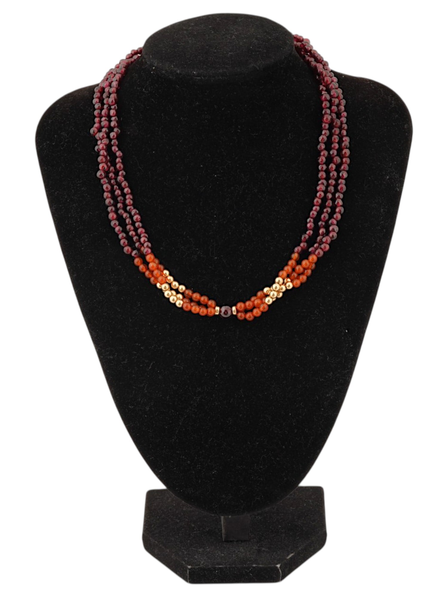 VINTAGE GARNET CARNELIAN AND GOLD BEADED NECKLACE: A vintage multi-strand necklace composed of small garnet and carnelian beads, as well as gold fitting beads. Total Weight: 46.61 g. Mineral Stone Jewelry And Fashion Accessories. THIS LOT IS ELIGIBLE 
