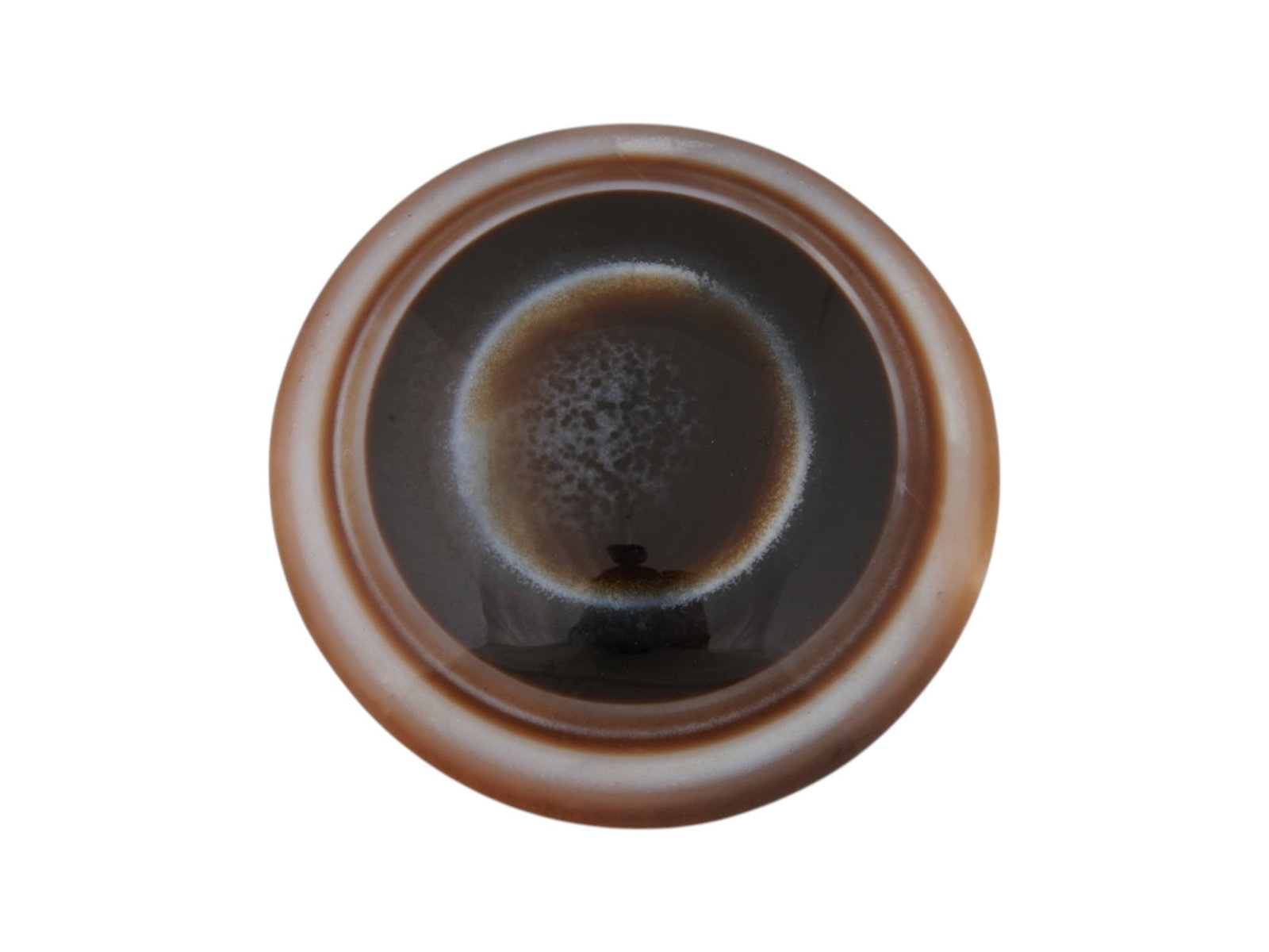 LARGE CIRCULAR CABOCHON FORM BANDED AGATE SPECIMEN: A large banded agate specimen carved into a circular cabochon form, featuring a striking natural bullseye pattern. The piece has been polished to a high luster on its domed face, while the reverse is 