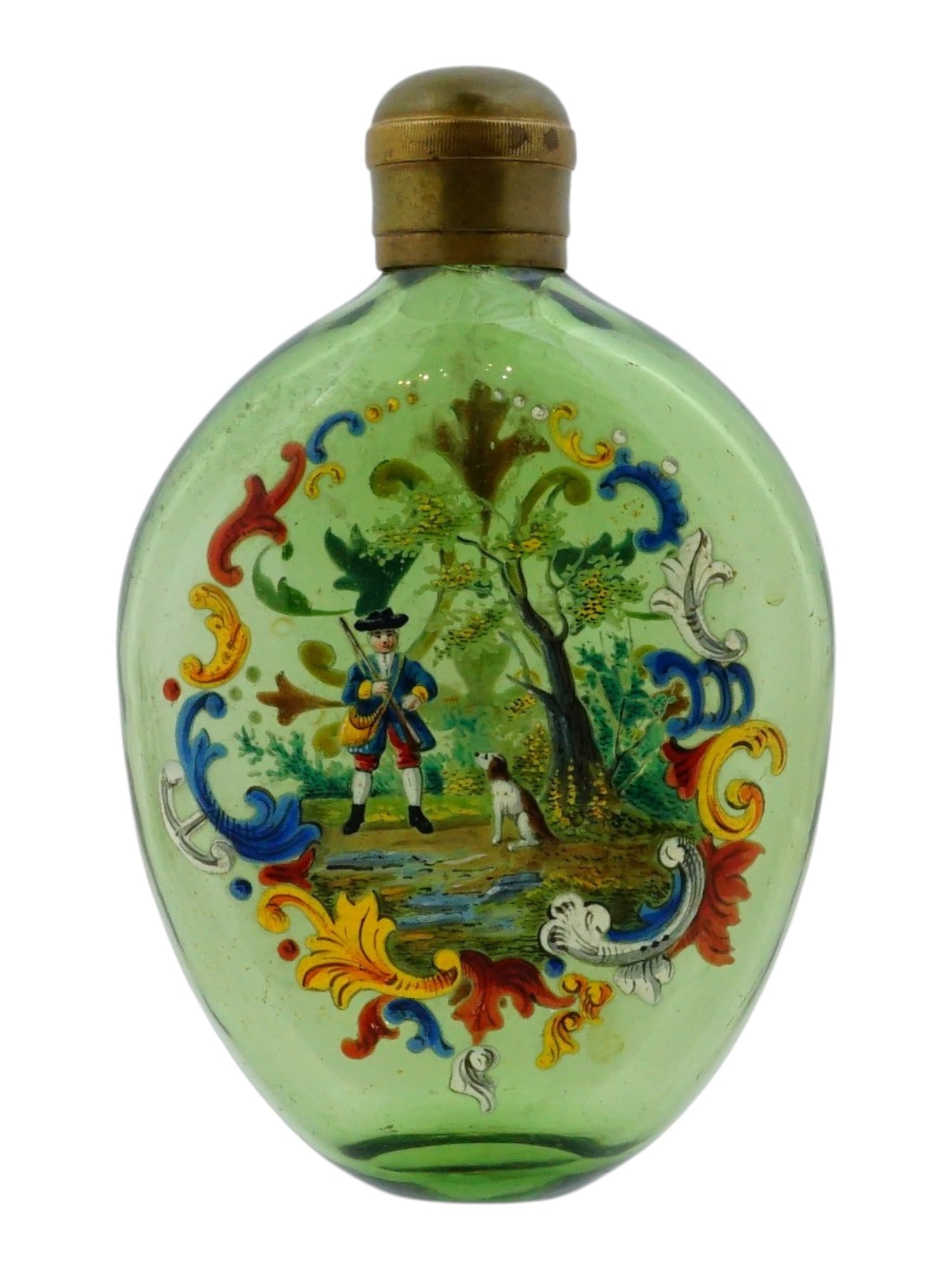 ANTIQUE BOHEMIAN EGERMANN ENAMEL GLASS HUNTING FLASK: An antique Bohemian hunting flask featuring a green glass body of a flattened oval form, extensively decorated with vibrant, hand painted polychrome enamel. The primary scene depicts a hunter in tradi