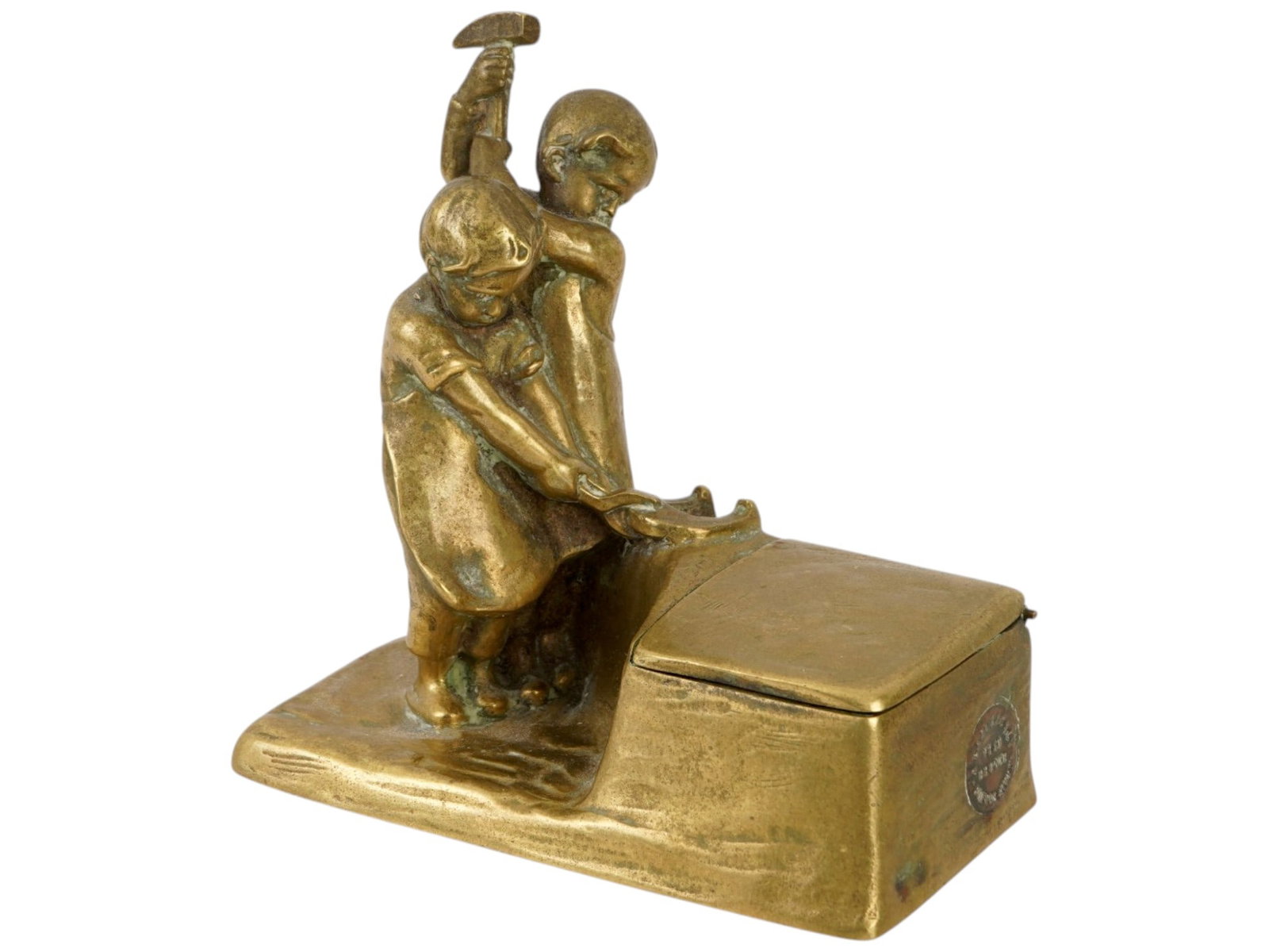AUSTRIAN BRONZE FIGURAL INKWELL BY PETER TERESZCZUK: A gold patinated bronze sculptural inkwell designed by the renowned sculptor Peter Tereszczuk, 1875 to 1963. The composition is decorated with two figures of working children. The piece bears a cast s