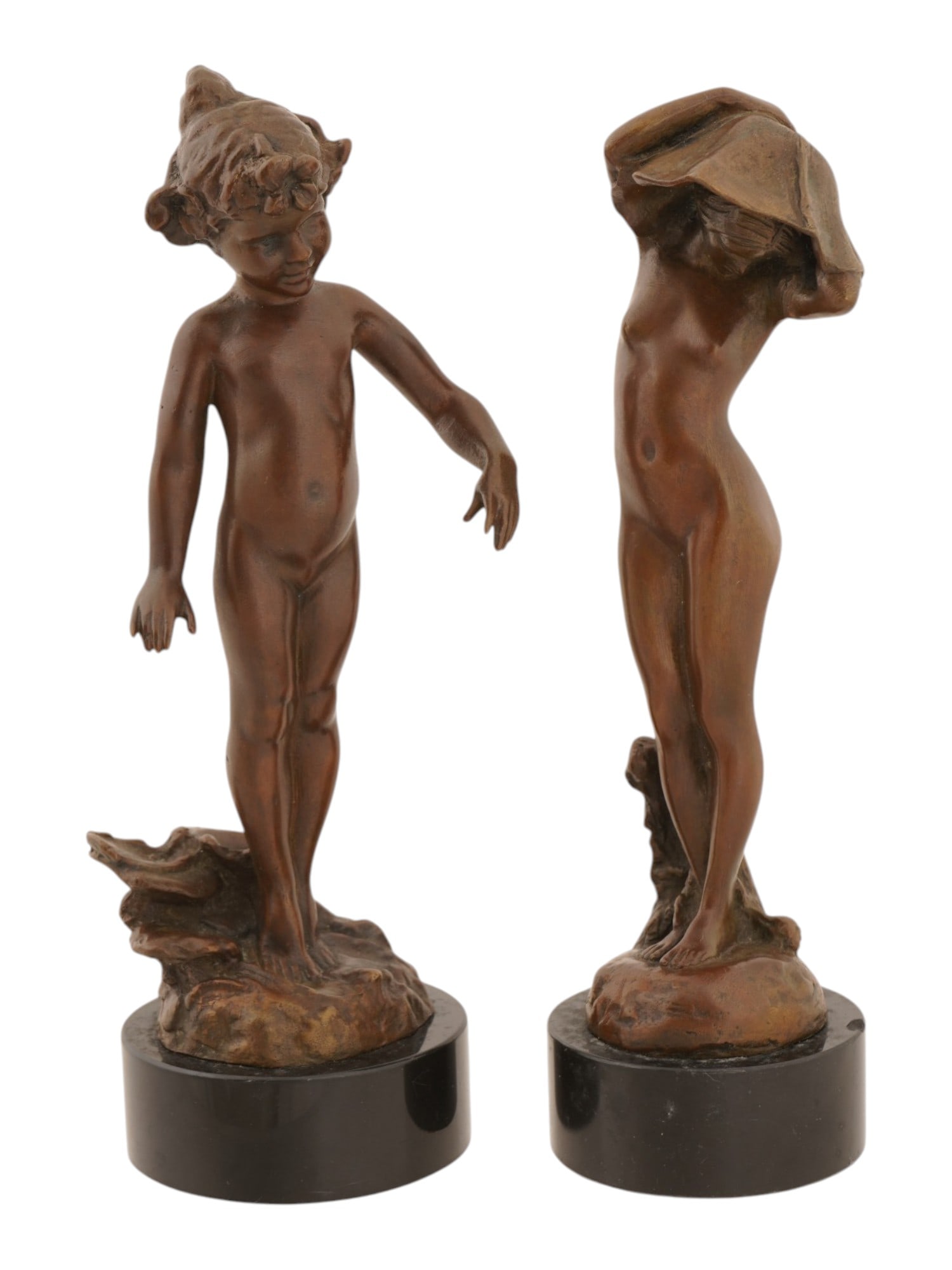 ANTIQUE BRONZE SCULPTURES OF NUDE FEMALE NYMPHS: A pair of antique bronze sculptures depicting whimsical nude female nymphs in the Art Nouveau and early 20th-century decorative style. One figure is based on Edward Henry Berges Wildflower or Lily Pad