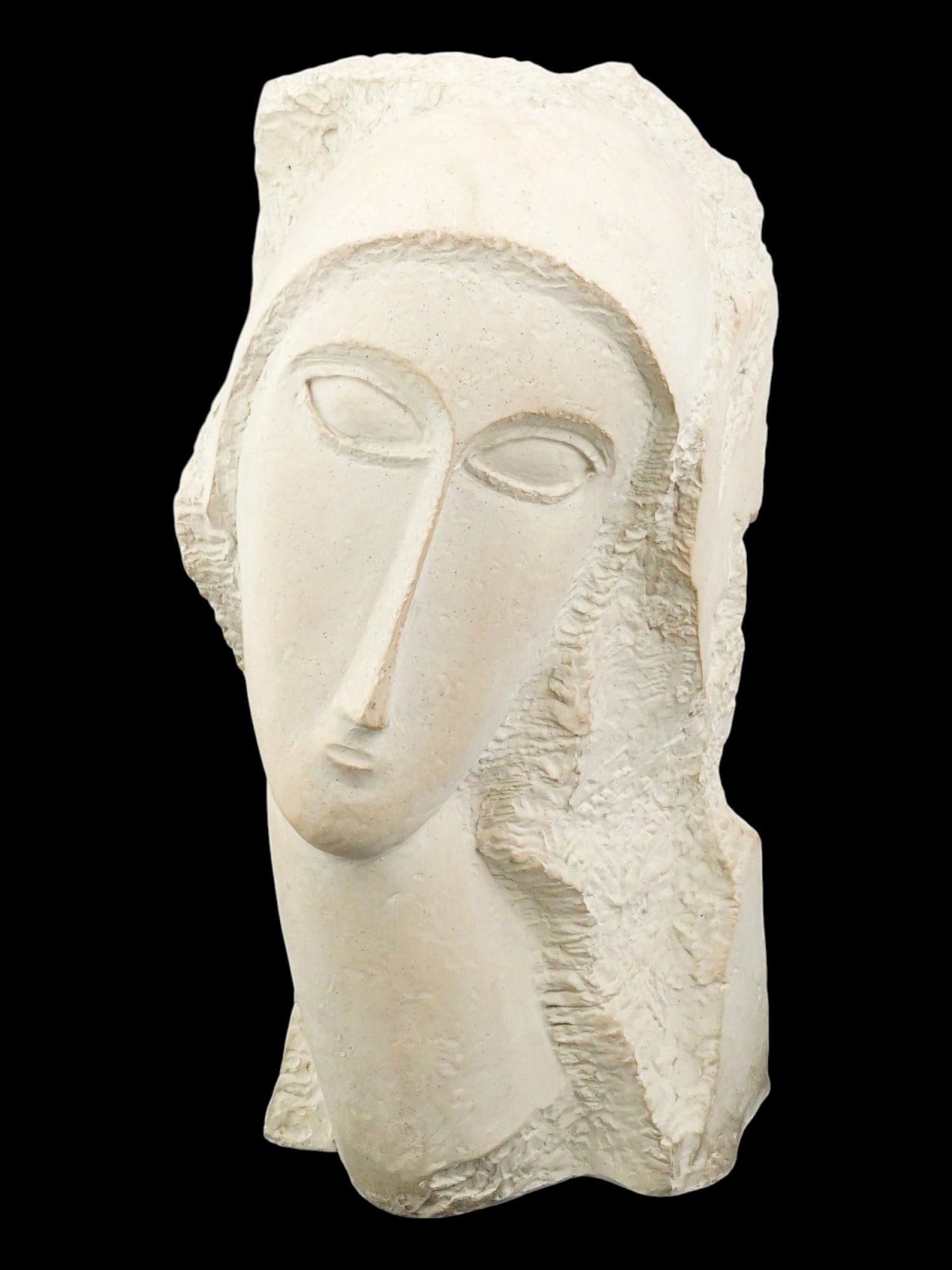 AFTER AMEDEO MODIGLIANI FEMALE PORTRAIT SCULPTURE: After Amedeo Modigliani, Italian, 1884 to 1920, plaster sculpture. Female portrait. Marked on the bottom: Austin Prod. Inc., 1985. Mounted on a stone base. Amedeo Modigliani was a painter and sculptor