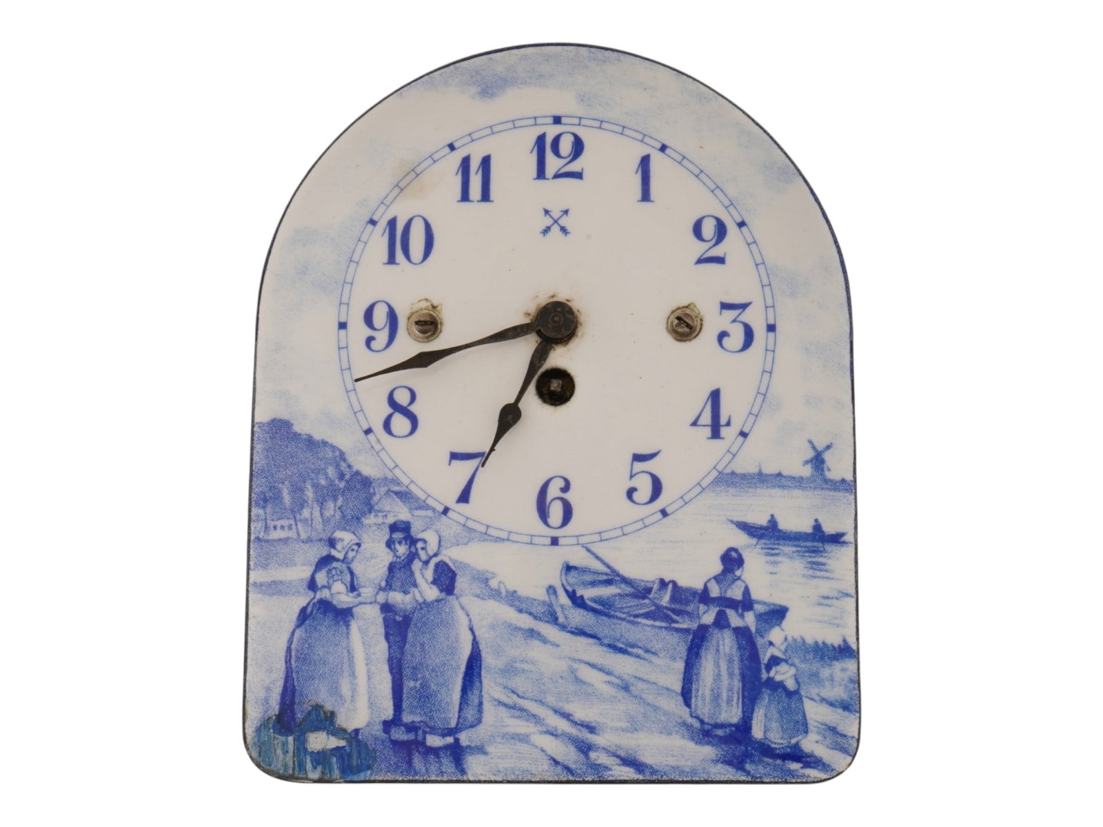 VINTAGE GERMAN PORCELAIN ENAMEL ON METAL WALL CLOCK: A vintage German porcelain-enamel on metal wall clock dating from the 1930s to 1940s, decorated in the traditional Dutch Delft Blue style with pastoral imagery. The arched dial features blue Arabic
