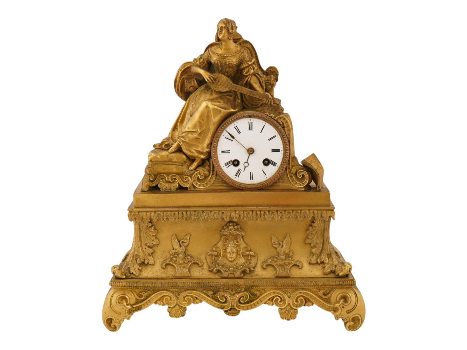 ANTIQUE 19TH C FRENCH GILT BRONZE MANTEL CLOCK: An antique French gilt bronze mantel clock. Dated mid-19th century. Footed base with relief swans, mascarons, and acanthus leaf motifs supports a female figurine playing the mandolin. The clock houses