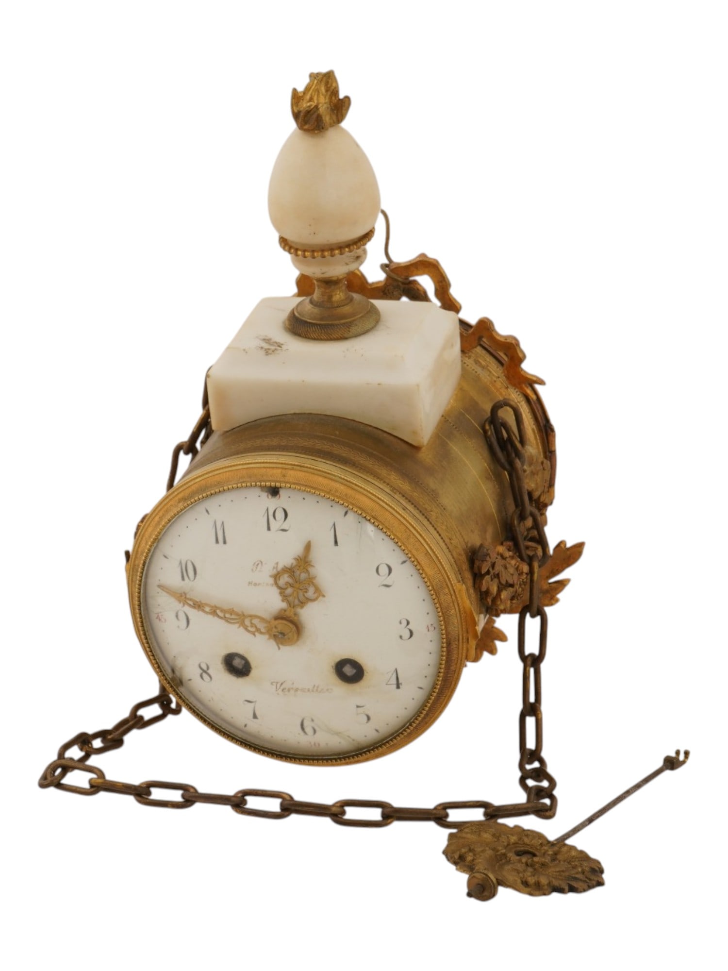 ANTIQUE FRENCH VERSAILLES LOUIS XVI GILT BRONZE CLOCK: An antique French Versailles Louis XVI gilt bronze hanging clock with a key. Circa the late 18th century. The French cylindrical clock features a round enamel dial with Arabic numerals and marked