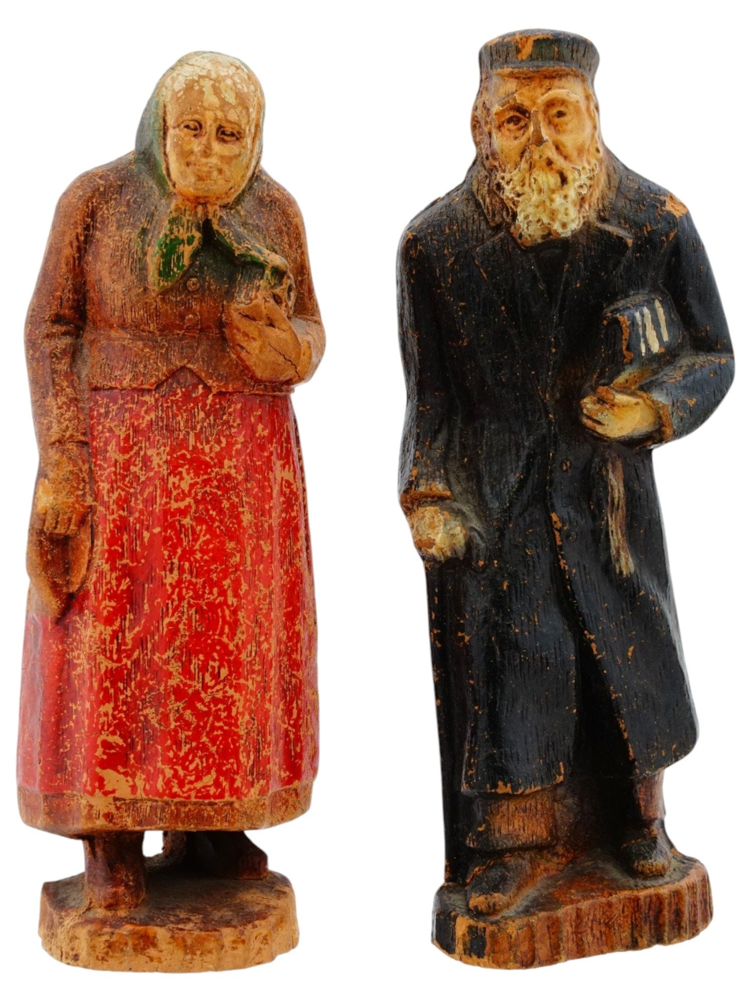 ANTIQUE RUSSIAN HAND PAINTED WOOD FOLK ART FIGURES: An evocative pair of hand painted wooden figures representing a charming example of 19th century Russian folk art most likely depicting an elderly Jewish couple from a traditional shtetl. The deeply e