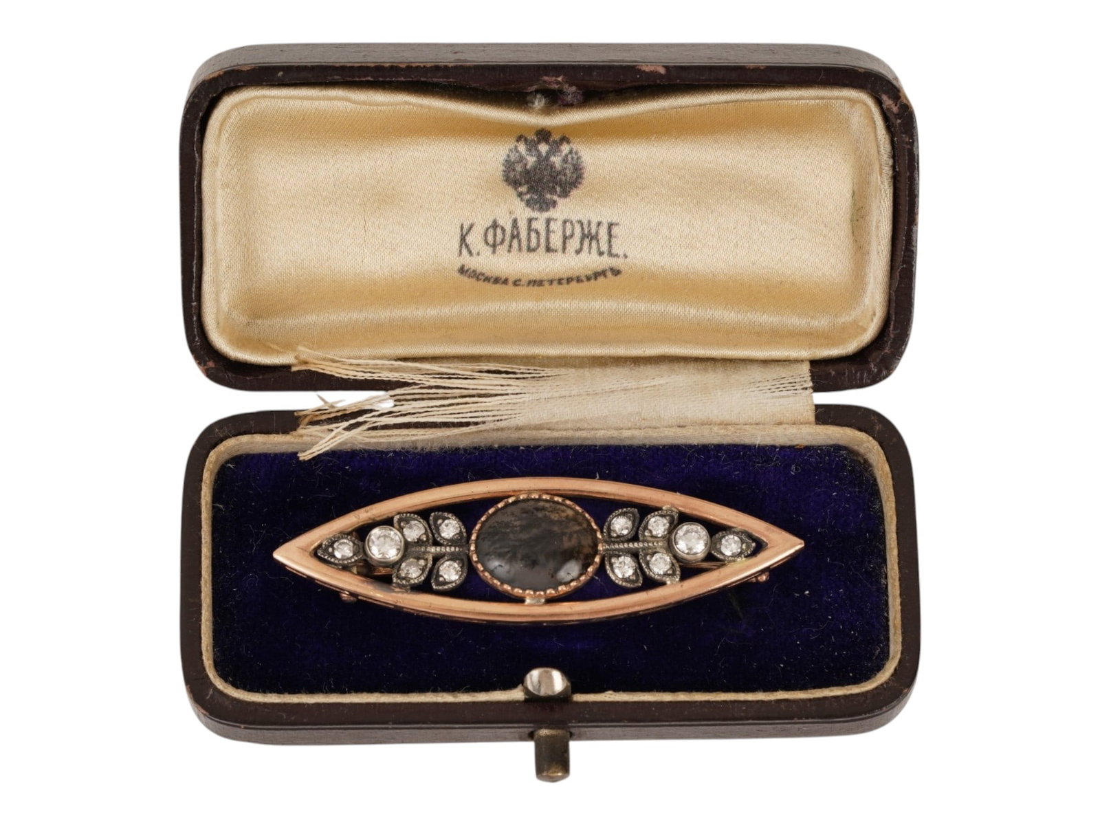 RUSSIAN GOLD MOSS AGATE AND DIAMOND PIN BROOCH: A Russian gold pin brooch. Marquise-shaped piece with a large central moss agate cabochon, flanked by diamond-set leaf motifs. Hallmark of 56 gold standard and makers mark are on the pin. Total Weight
