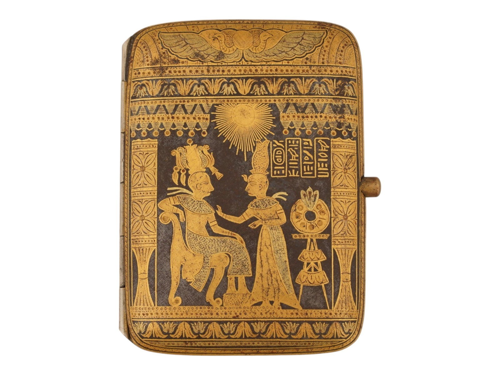 VINTAGE EGYPTIAN REVIVAL GILT SILVER CIGARETTE CASE: A vintage Egyptian Revival gilt silver cigarette case,1985. The case depicts an engraved scene with a young Pharaoh Tutankhamun, seated on a chair, and his wife Queen Ankhesenamun. Engraved on the bot