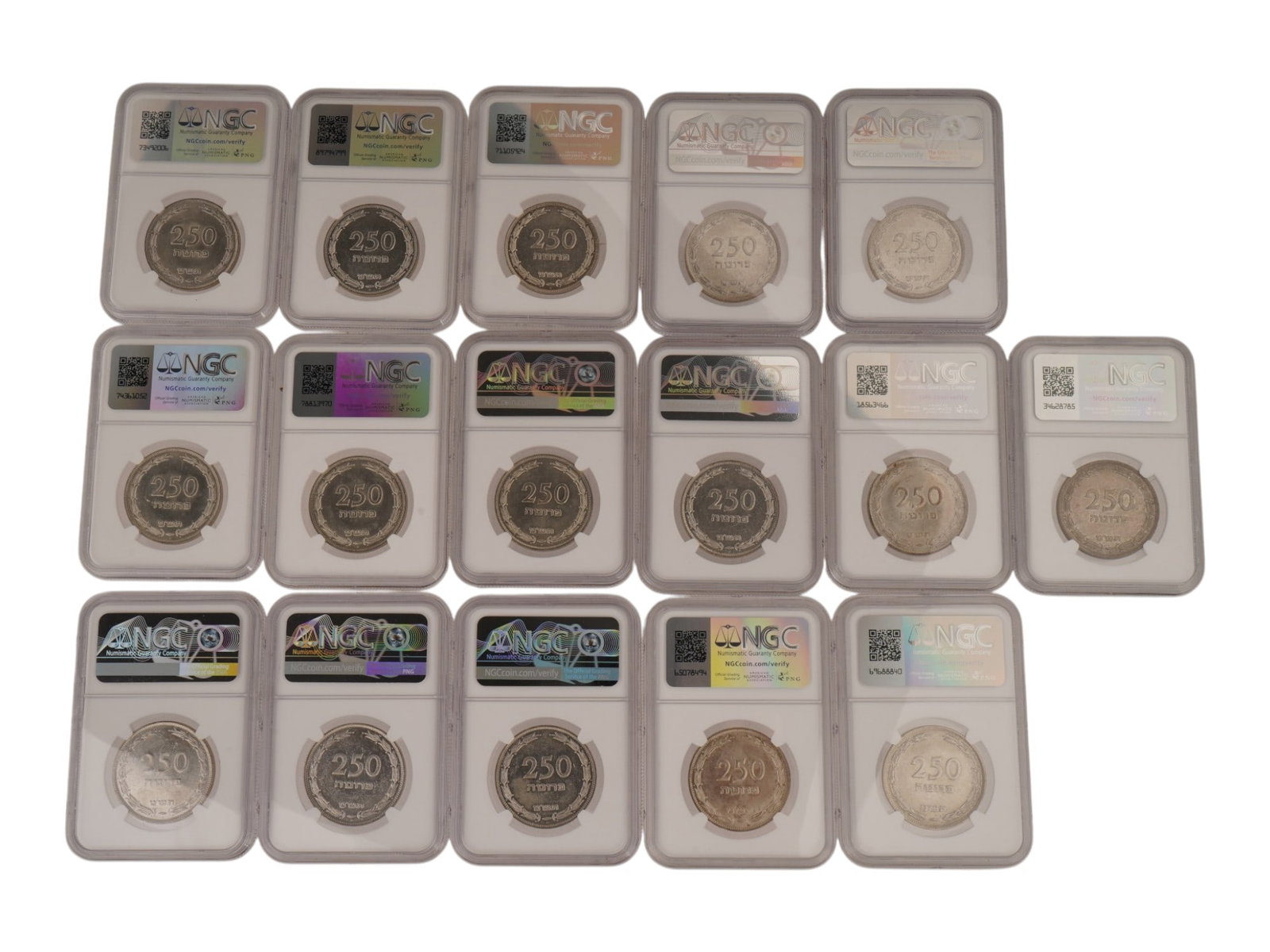SIXTEEN ISRAELI CERTIFIED 250 PRUTA SILVER COINS 1949: A lot of sixteen Israeli 250 Pruta silver coins issued in 1949, JE 5709, and struck at the Heaton Mint, Birmingham. Each specimen is professionally certified and encapsulated by the Numismatic Guarant