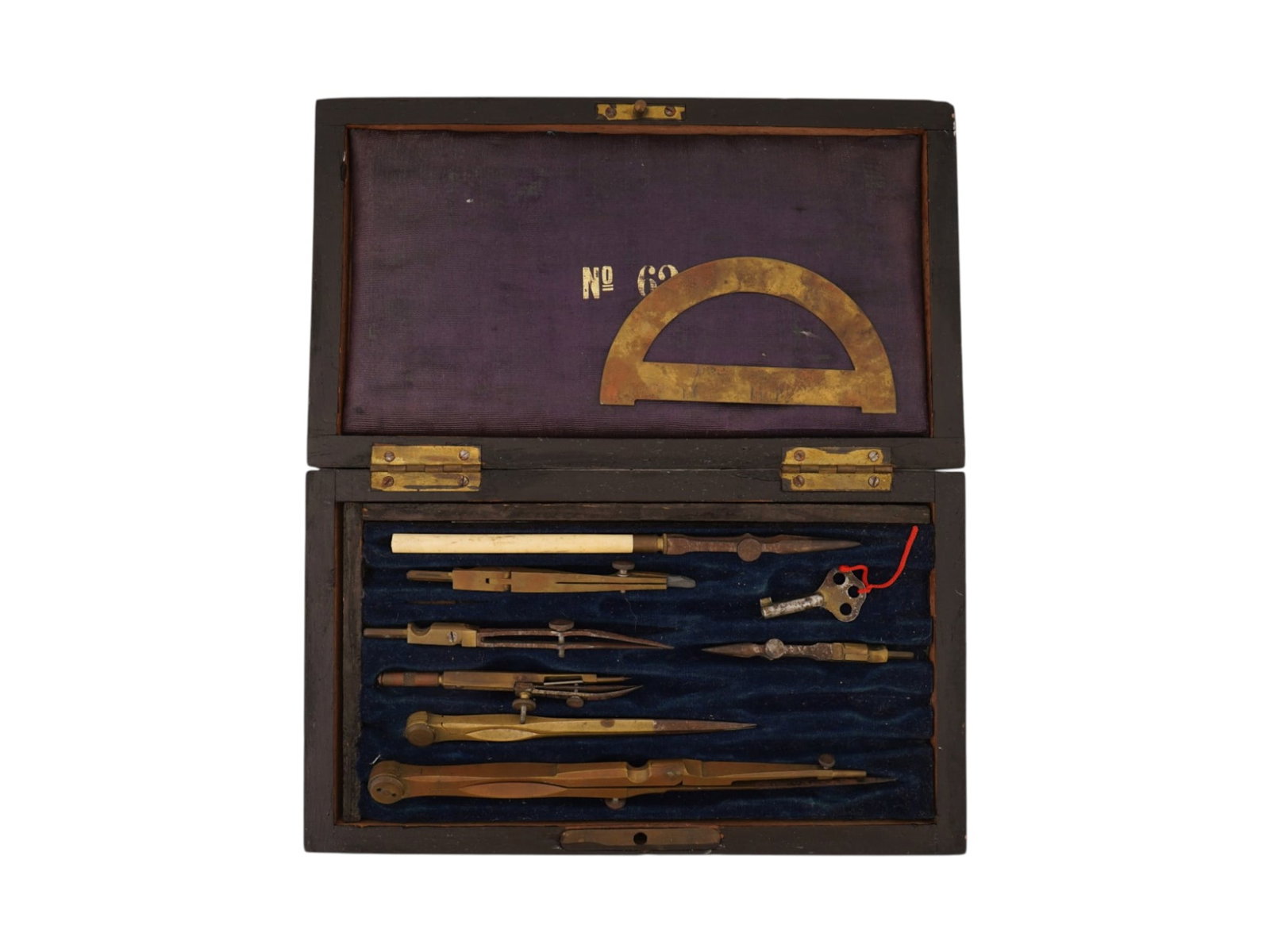 19TH CENTURY FRENCH NAPOLEON III PERIOD DRAFTING SET: A French Napoleon III period drafting set, dating from the mid to late 19th century, is housed in a rectangular wooden case with a velvet lined interior. The assembly includes a variety of brass and s