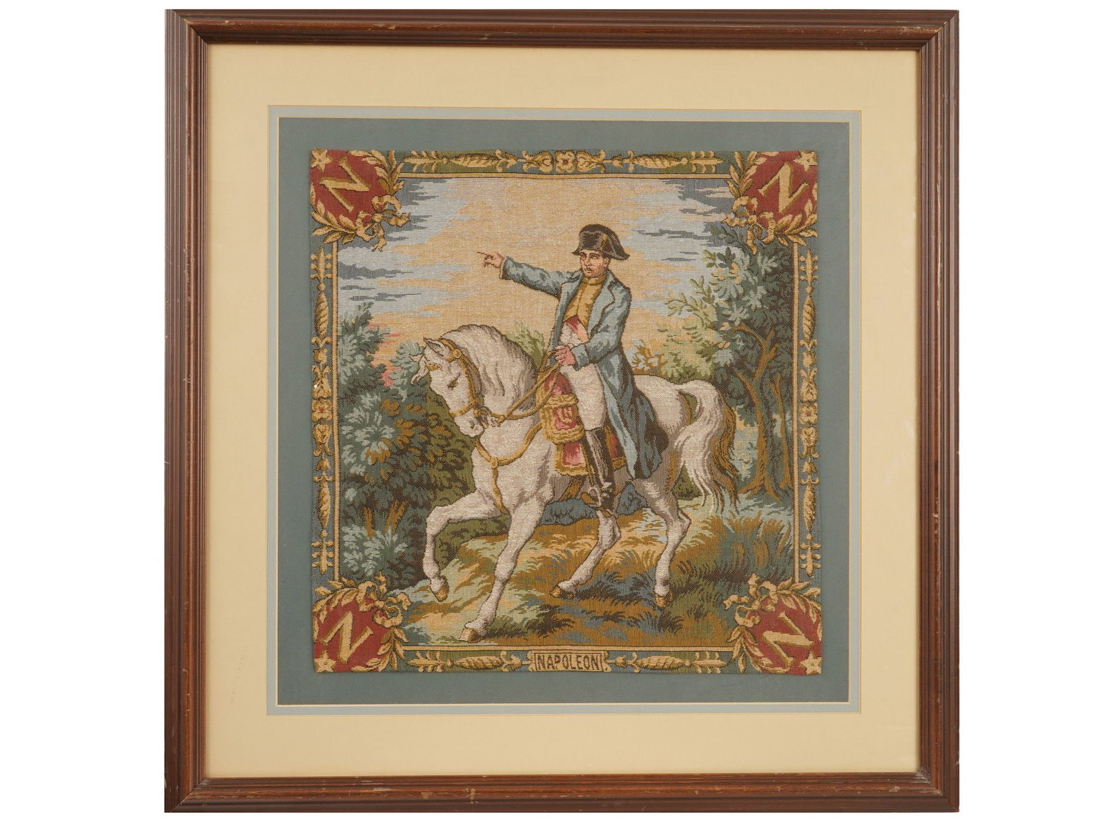 VINTAGE FRENCH EMBROIDERED TAPESTRY W NAPOLEON: A vintage French Aubusson-manner embroidered tapestry. The tapestry depicts Napoleon Bonaparte riding a white horse with the rulers monograms and a decorative border. It is matted and framed. European