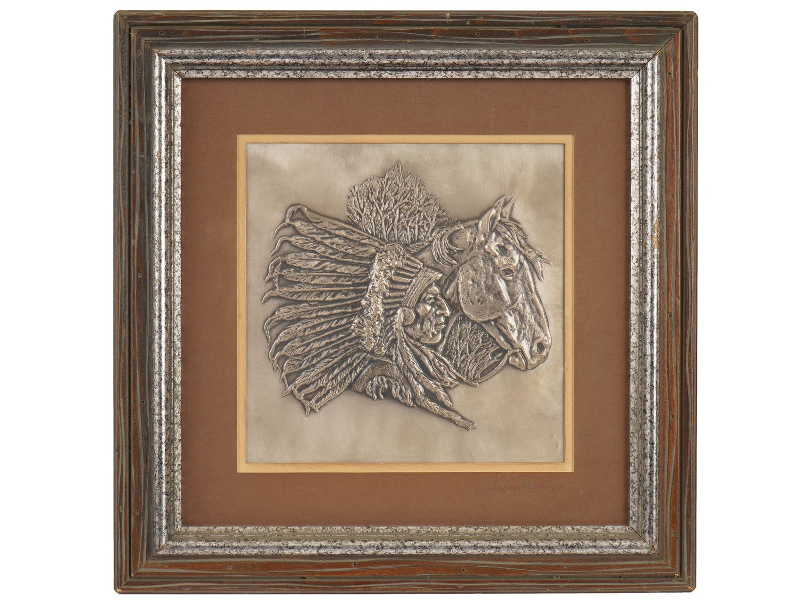 AMERICAN SILVER PLATED BAS RELIEF BY GORDON PHILLIPS: A vintage American silver plated bas-relief titled The Chieftain by Gordon Phillips, 1976. Part of the The Westerners collection. The relief image of an American Indian chief in a traditional feather 