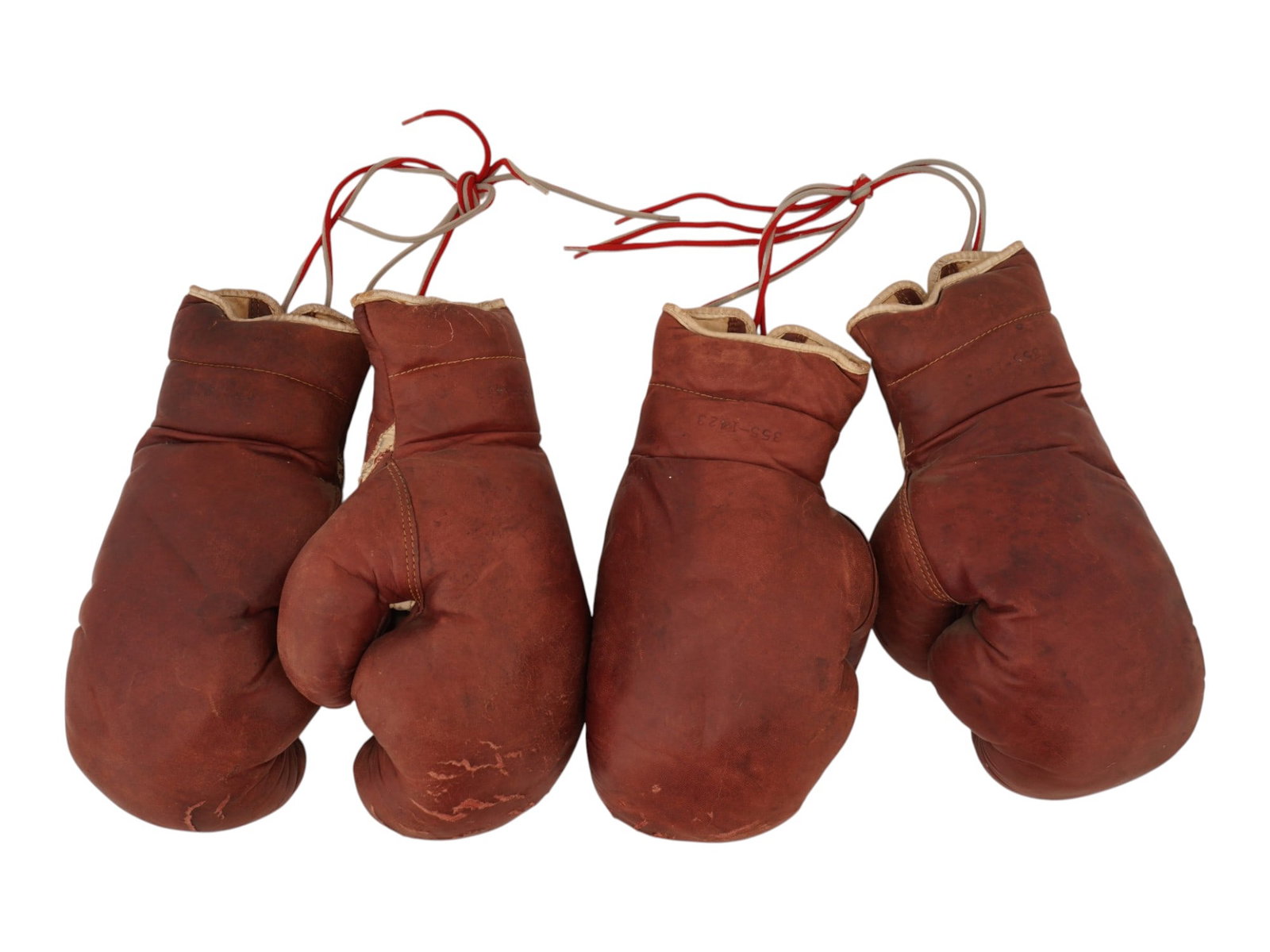 TWO PAIRS OF VINTAGE BROWN LEATHER BOXING GLOVES: A lot of two pairs of vintage boxing gloves made of thick genuine leather with cotton wool inside. Circa mid 20th century. Vintage Boxing Gloves And Sport Accessories Collectors. THIS LOT IS ELIGIBLE