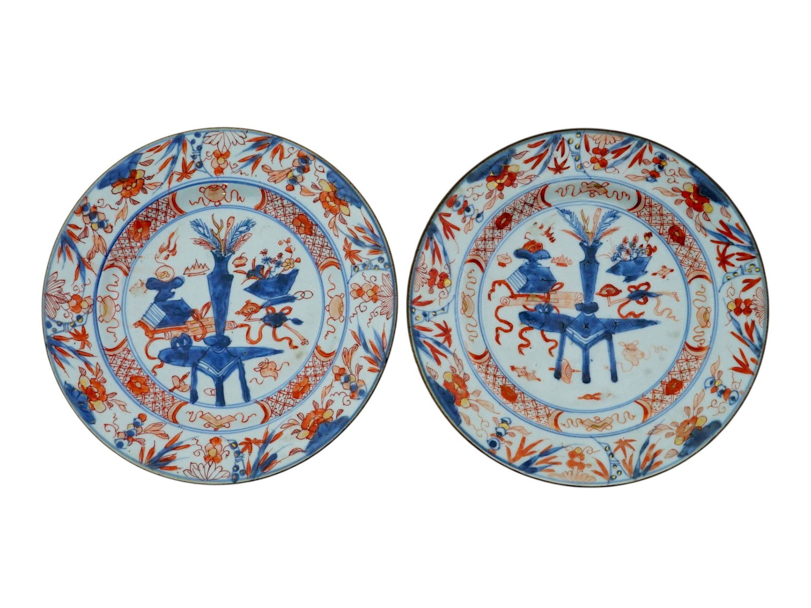 PAIR OF ANTIQUE 18TH C CHINESE IMARI PORCELAIN PLATES: A pair of antique Chinese hand-painted porcelain plates in Imari style. Qing dynasty, late 18th century. Oxblood red and cobalt blue still life altar compositions in the center, floral borders. Gold a