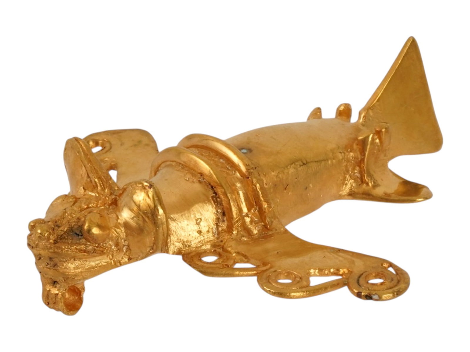 ANCIENT PRE COLUMBIAN TAIRONA TUMBAGA INSECT EFFIGY: An ancient Pre Columbian Tairona tumbaga pendant, an effigy representing a stylized flying insect resembling an airplane. Tumbaga, an alloy of gold and copper, showcases the metallurgical proficiency 