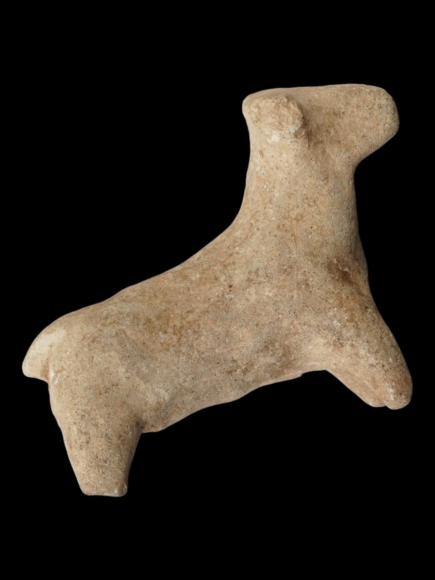 ANCIENT SYRO HITTITE TERRACOTTA BULL FIGURINE: An ancient Syro-Hittite terracotta bull figurine, circa 1200 to 900 BC, from the late Bronze Age to early Iron Age transition. The abstracted form, with a columnar torso and stylized snout, reflects t