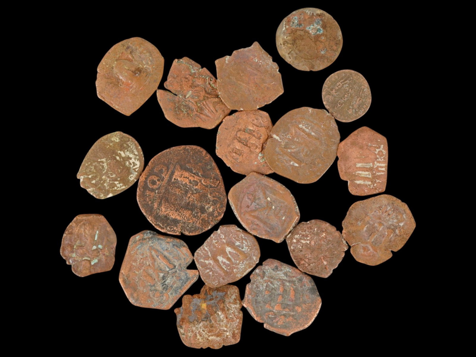 LOT OF ANCIENT BYZANTINE BRONZE COINS 400 TO 600 AD: A collection of assorted ancient Byzantine Empire bronze coins in various sizes. Circa 400 TO 600 AD. Featuring a diverse array of designs. The collection includes a Roman nummus or follis, and others